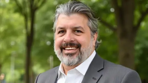 Eric Thompson Eric Thompson smiling at the camera