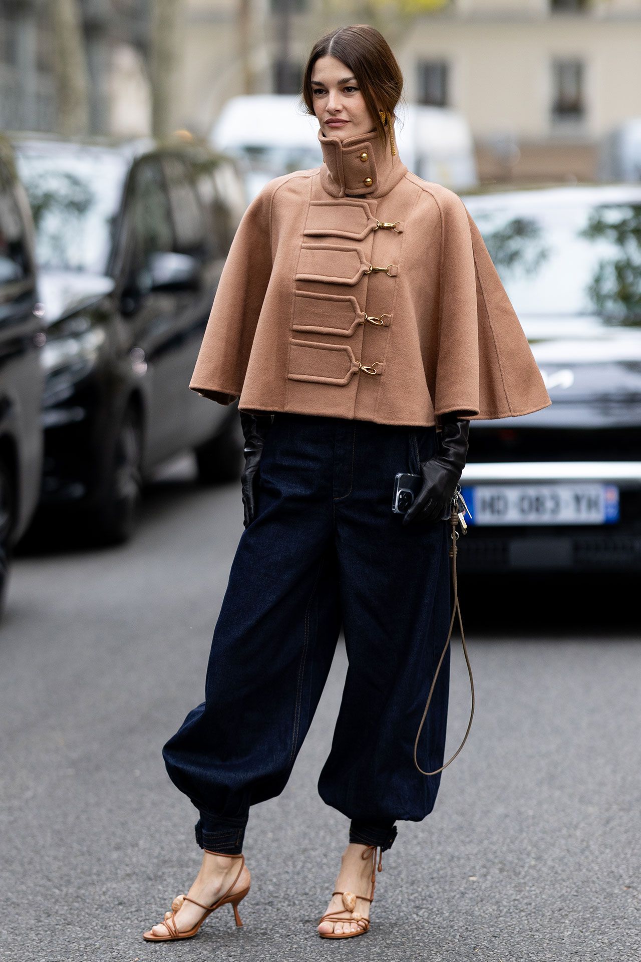 Image may contain Kirsty Lee Allan Clothing Pants Fashion Coat Cape Glove Adult Person and Jeans