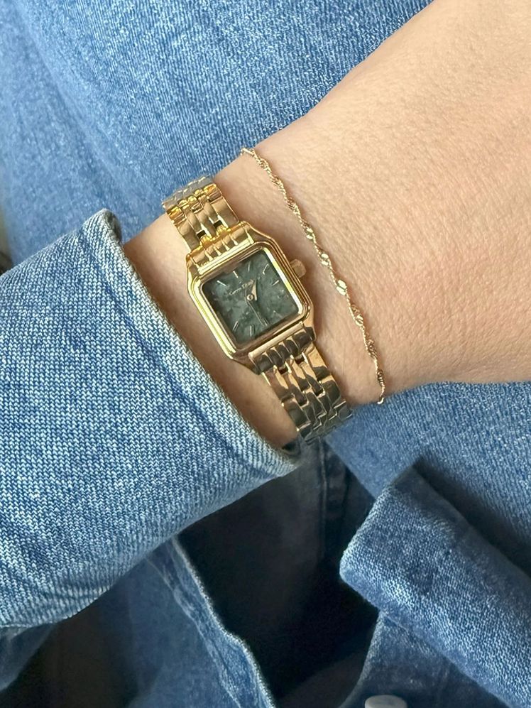 Image may contain: Accessories, Bracelet, Jewelry, Wristwatch, Arm, Body Part, and Person