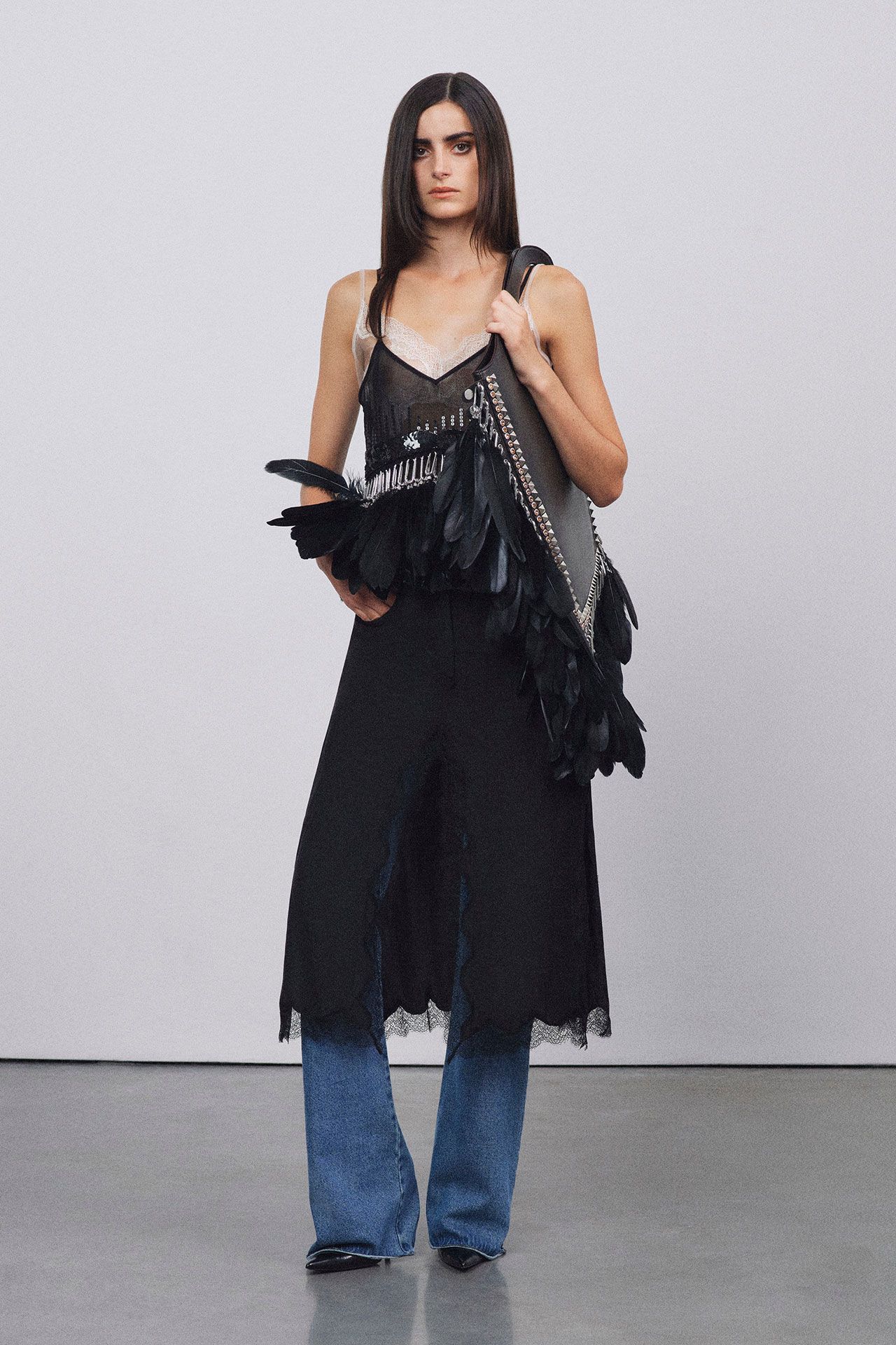 Image may contain Clothing Dress Pants Fashion Adult Person Blouse Coat and Jeans