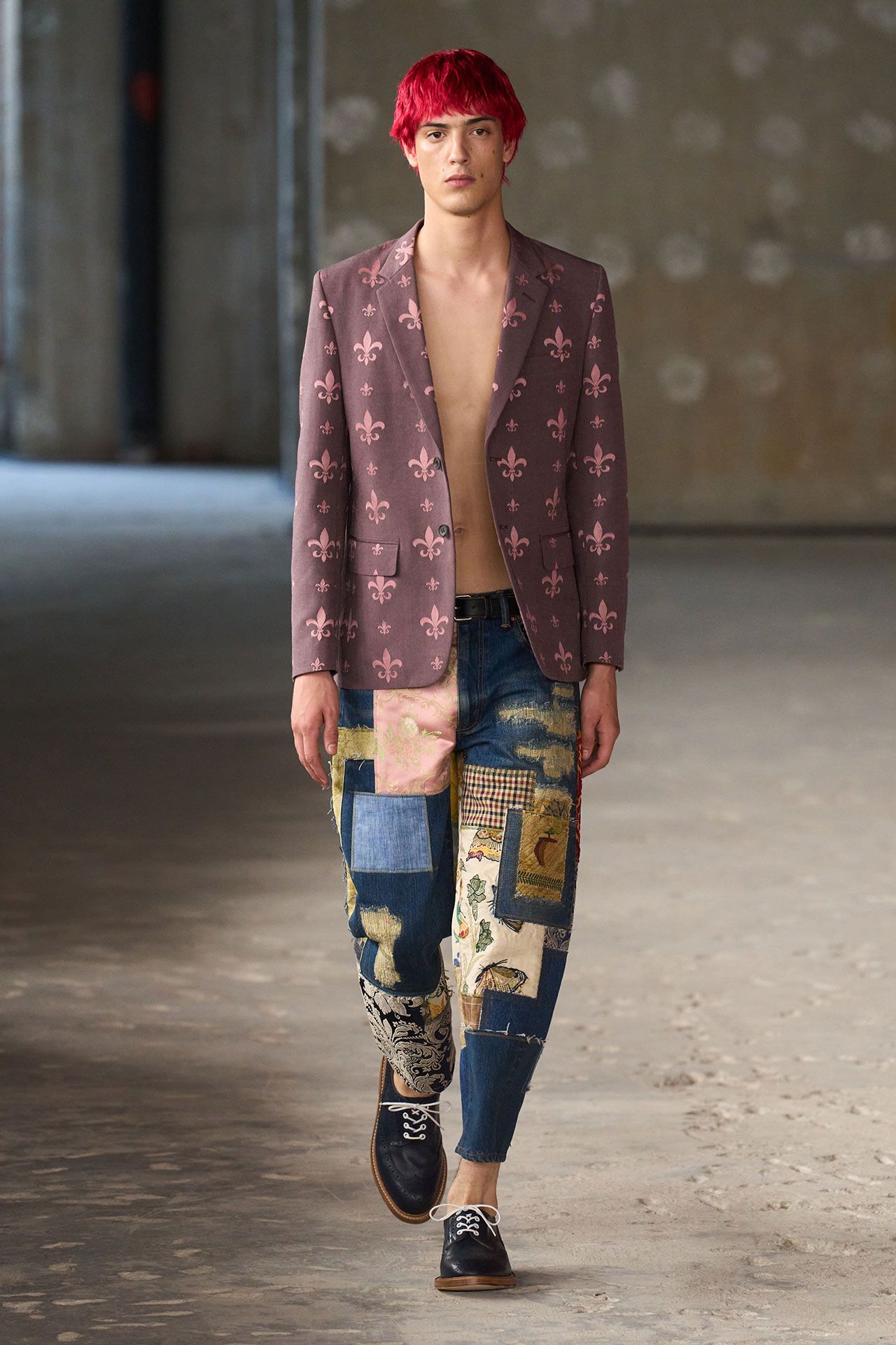 Image may contain Blazer Clothing Coat Jacket Pants Person Teen and Hair