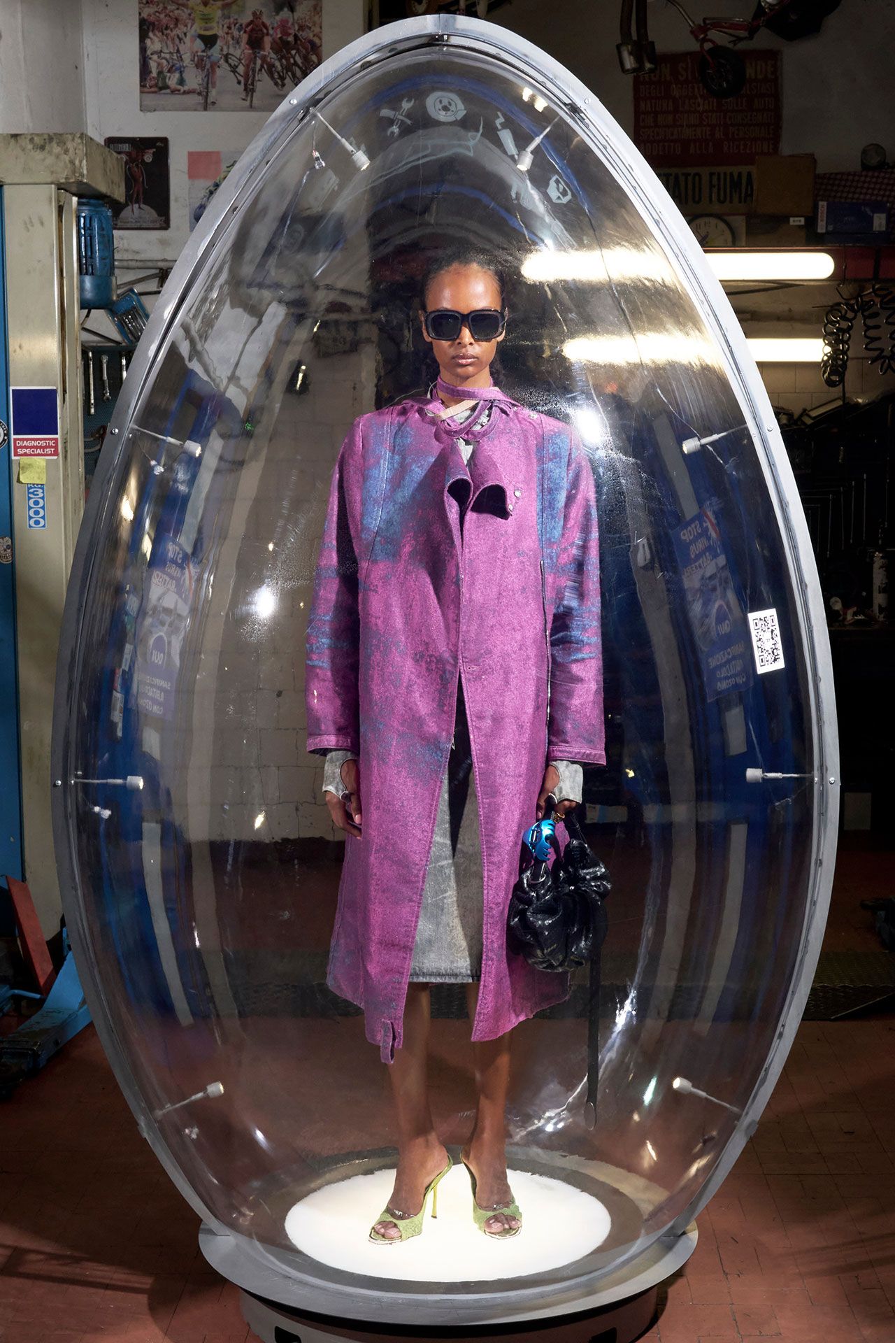 Image may contain Clothing Coat Photography Person Accessories Sunglasses Adult Standing Face Head and Portrait