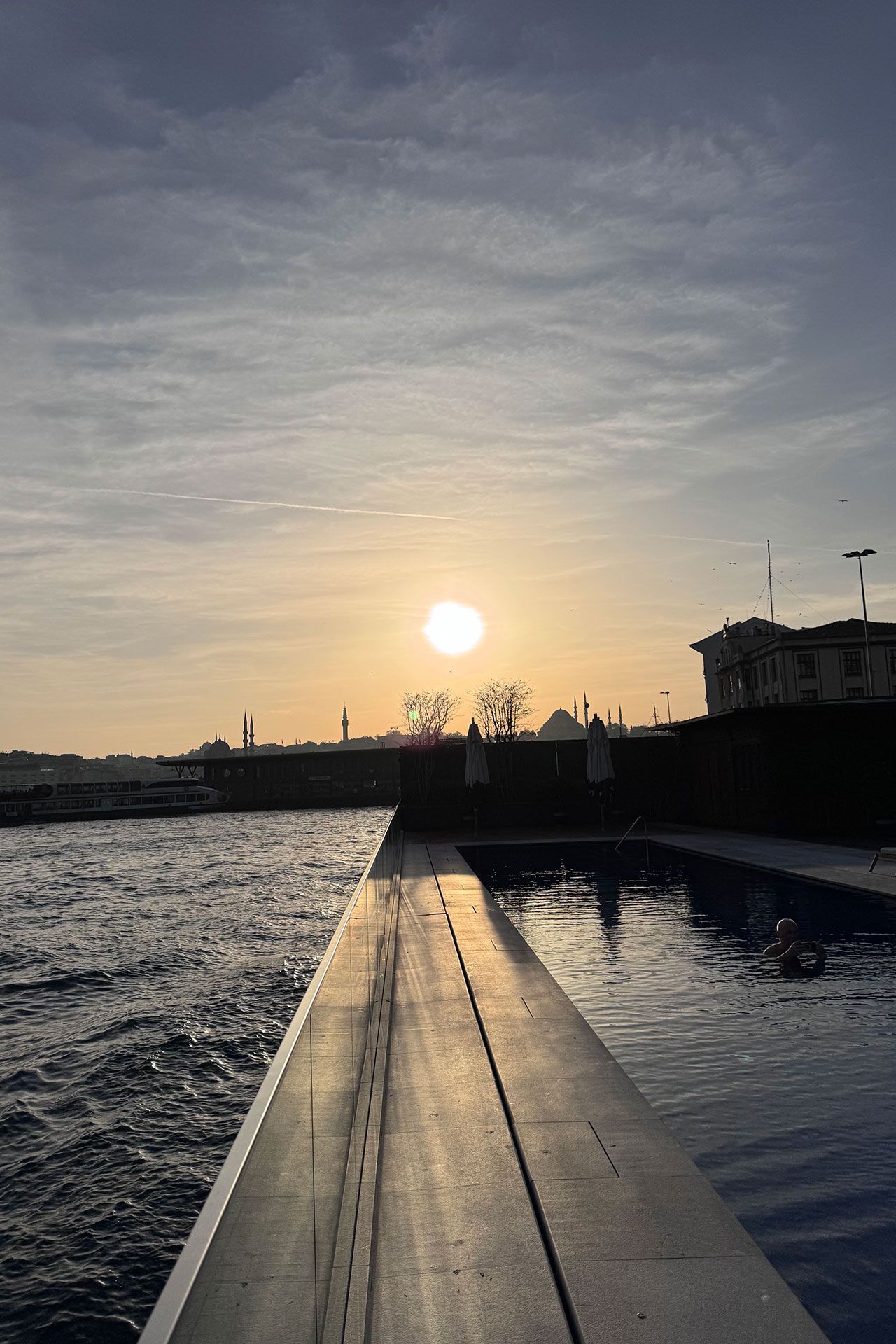 Image may contain Nature Outdoors Sky Horizon Water Waterfront Sun Architecture Building Cityscape and Urban