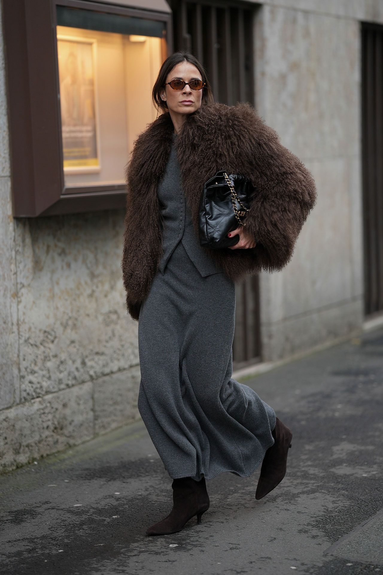 Image may contain Clothing Coat Adult Person Accessories Bag Handbag and Fur