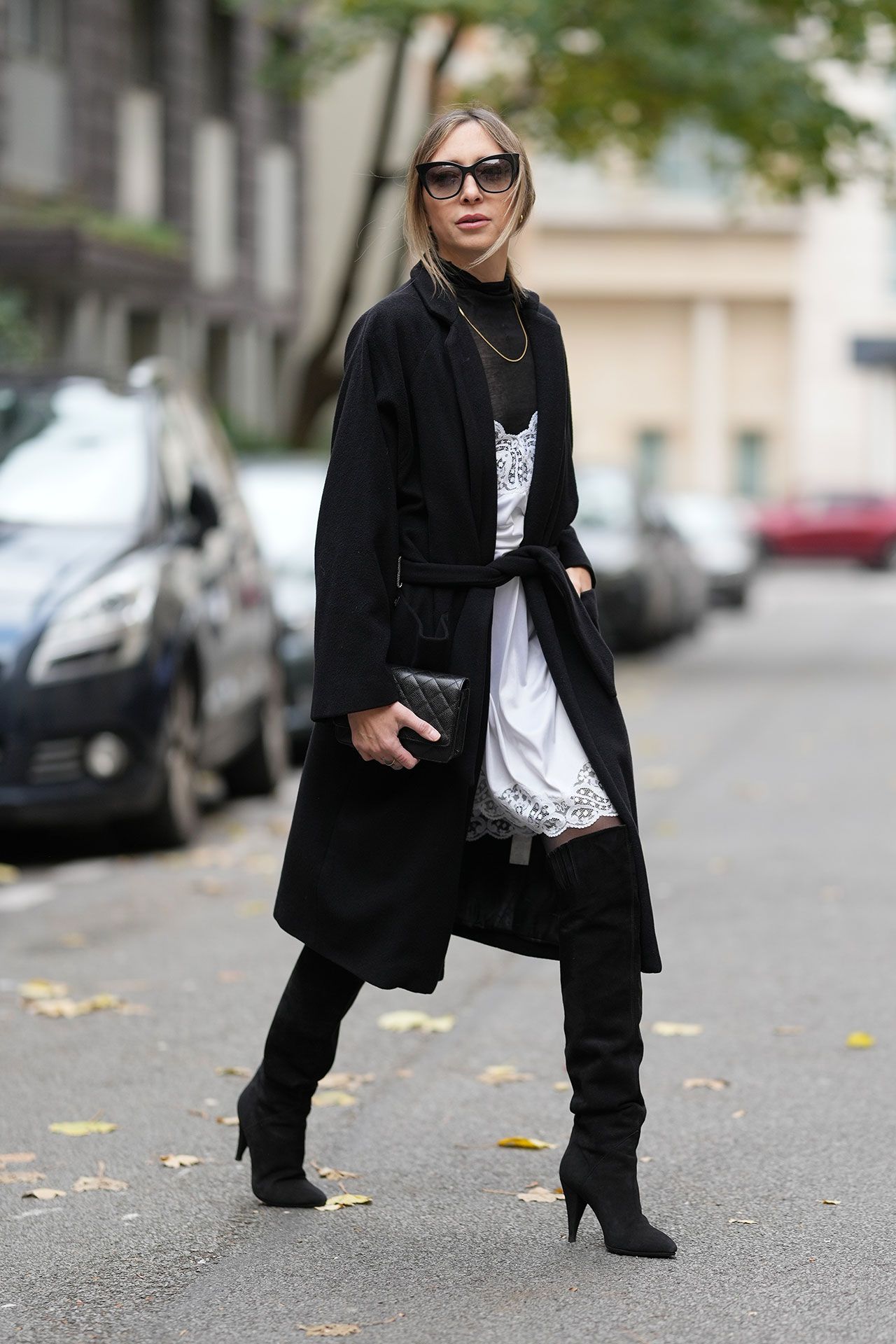 Image may contain Clothing Coat Overcoat Person Accessories Jewelry and Necklace