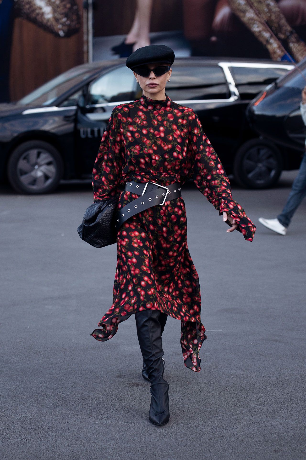 Image may contain Pedestrian Person Adult Car Transportation Vehicle Clothing Footwear and Shoe