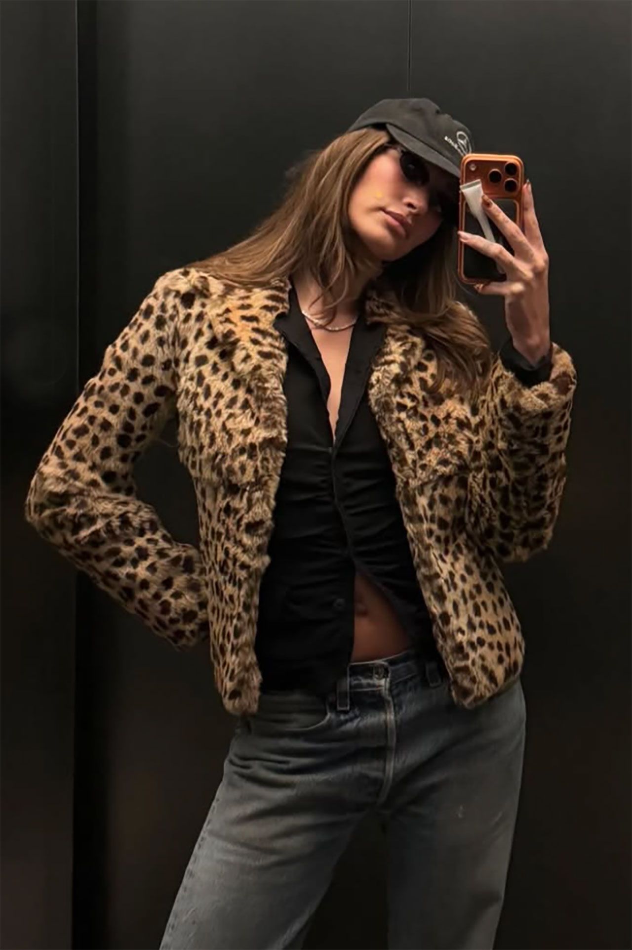 Image may contain Hailey Baldwin Clothing Sleeve Adult Person Coat Jacket Blazer Knitwear and Sweater