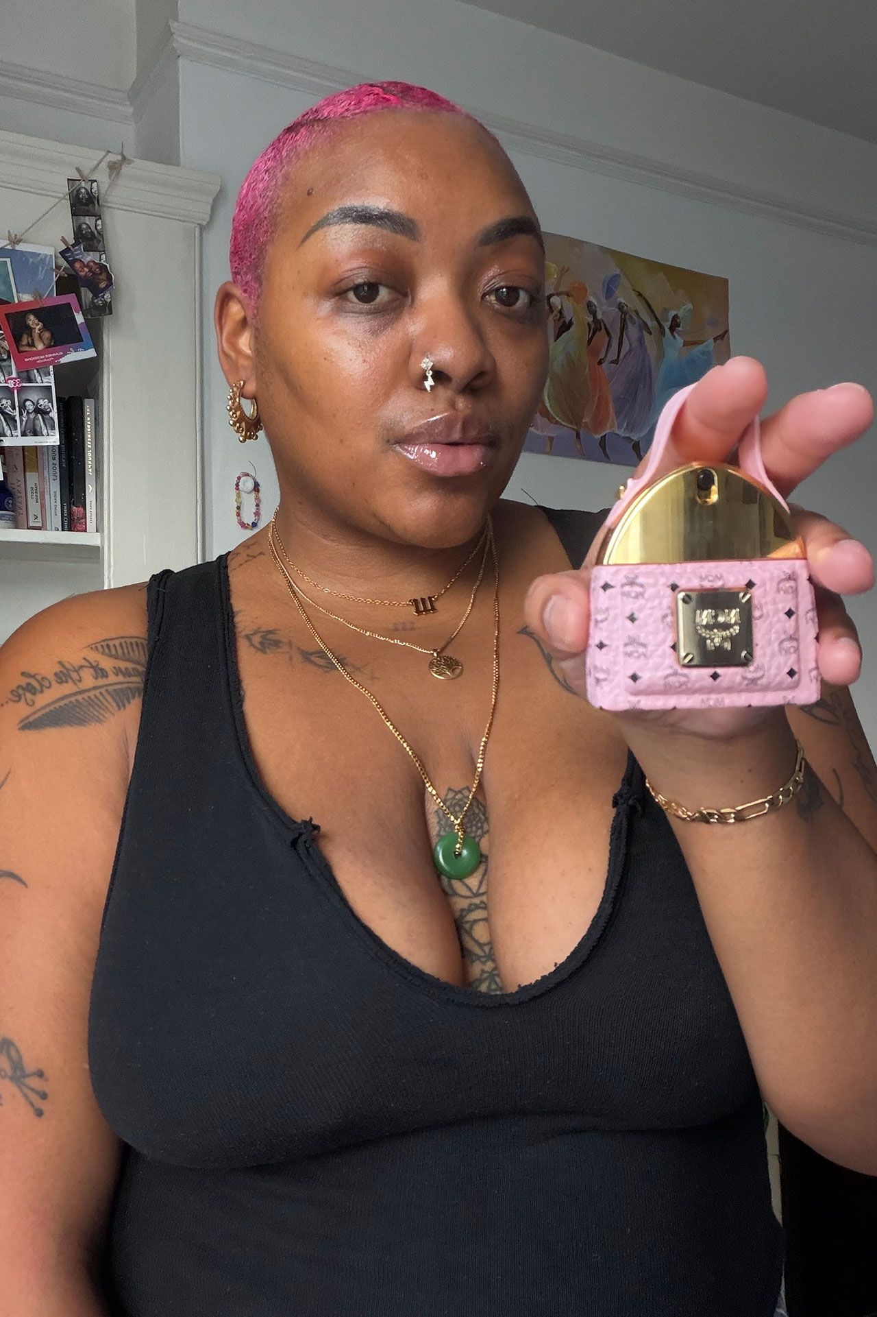 Image may contain Accessories Jewelry Necklace Person Face Head Wallet Hair and Pink Hair