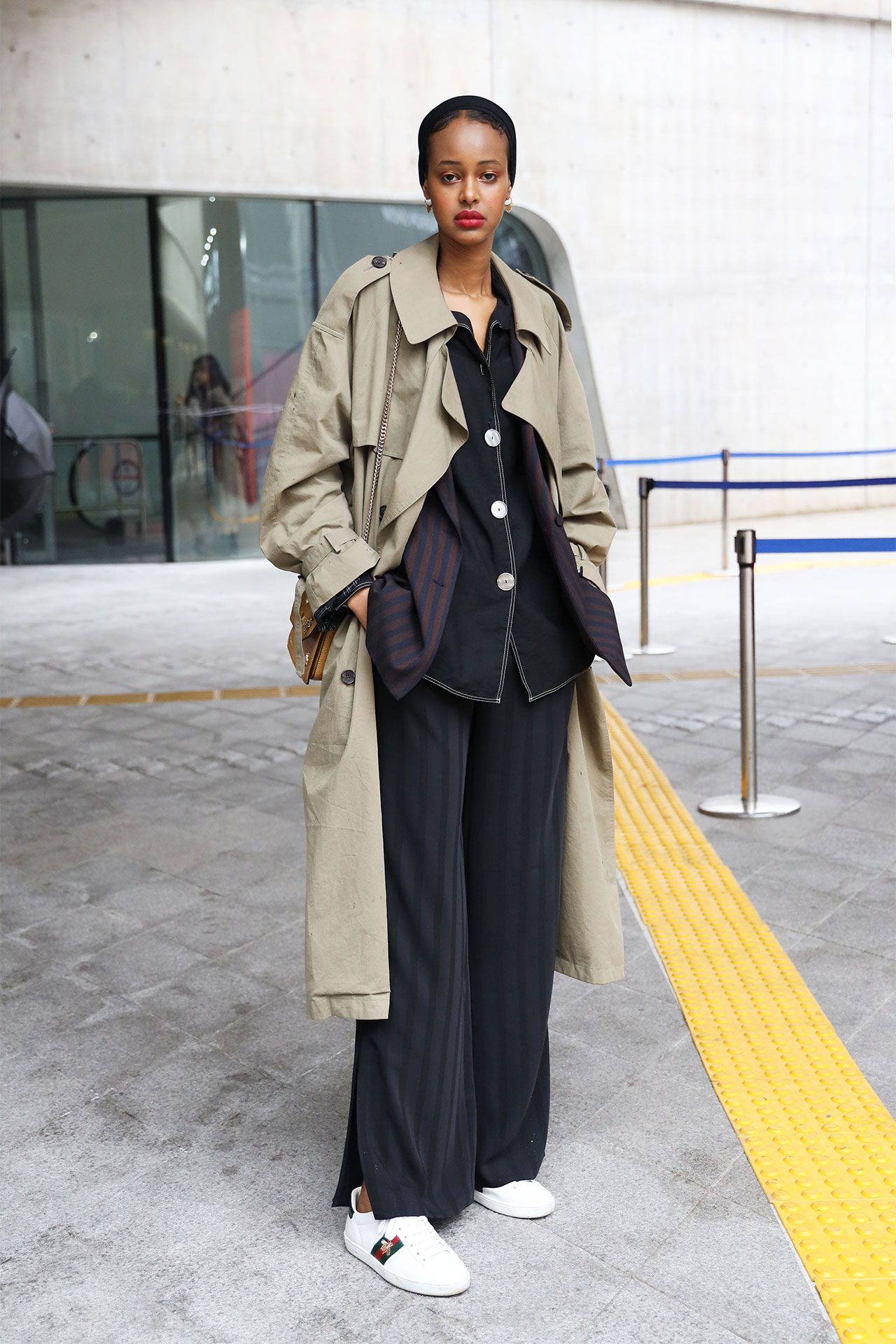 Image may contain Clothing Coat Overcoat Adult Person and Trench Coat