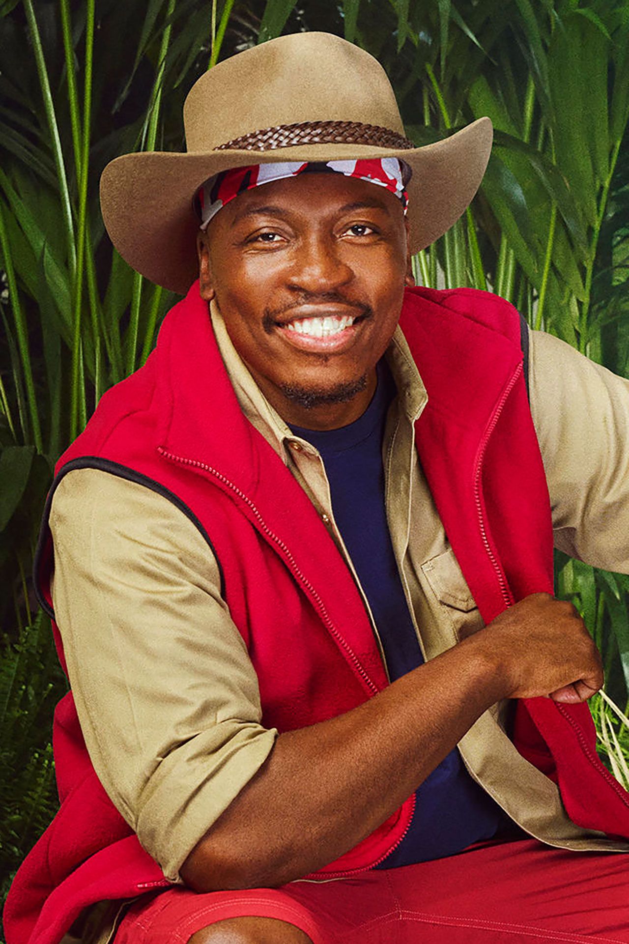 Image may contain Face Happy Head Person Smile Dimples Clothing Hat Photography Portrait and Adult