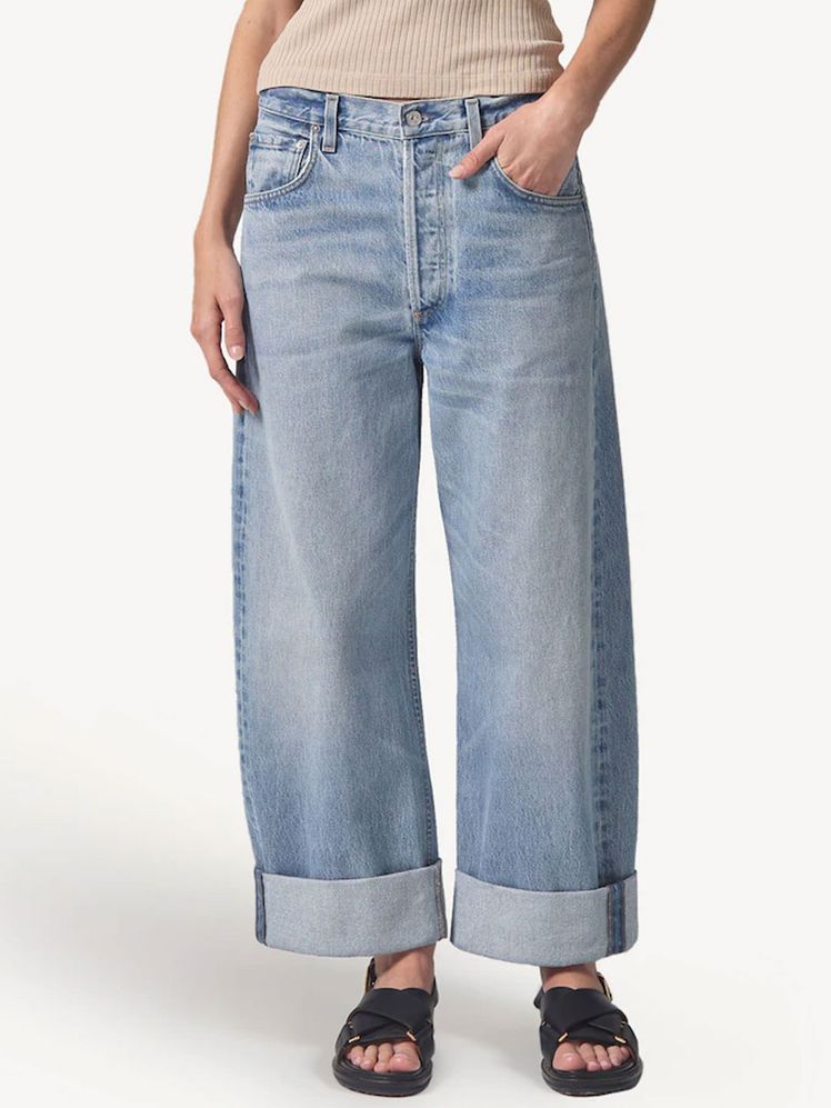 Image may contain: Clothing, Pants, Jeans, Footwear, and Sandal