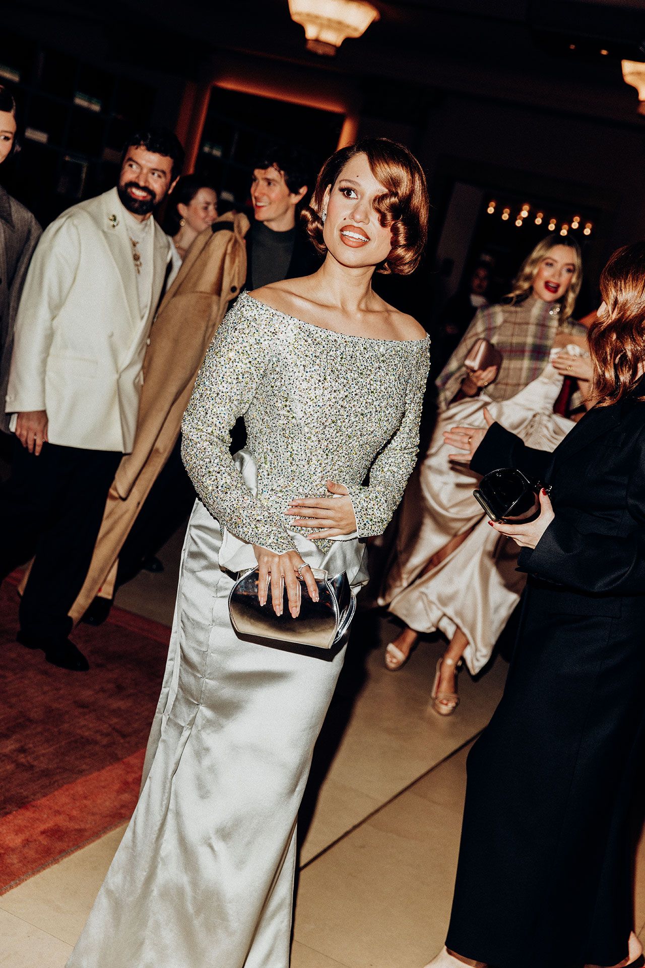 Image may contain Raye Zion Golan Laura Whitmore Fashion Person Adult Clothing Coat Wedding Dress and Photobombing