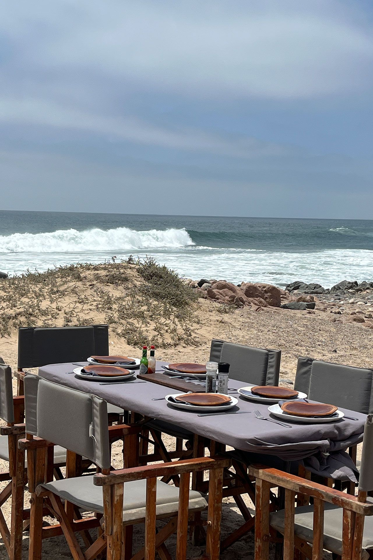 Image may contain Nature Outdoors Sky Dining Table Furniture Table Countryside Horizon Rural Farm Plate and Chair