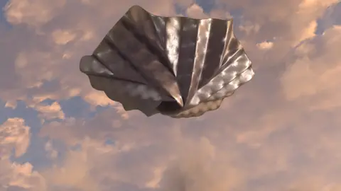 Space Forge An artists impression of the Space Forge satellite with its heat shield deployed. The shield is open and is silver, with a distinctive, fan-like shape - like an opened umbrella.  In the background is a pink sunset like sky with clouds. 