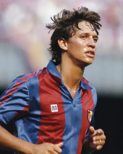 Hulton Archive/Getty Images Gary Lineker, in a burgundy and navy striped Barcelona football shirt, runs on the pitch