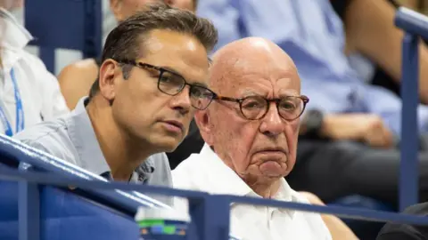 AFP via Getty Images Rupert Murdoch and his eldest son Lachlan, pictured at the US Open tennis tournament in 2018