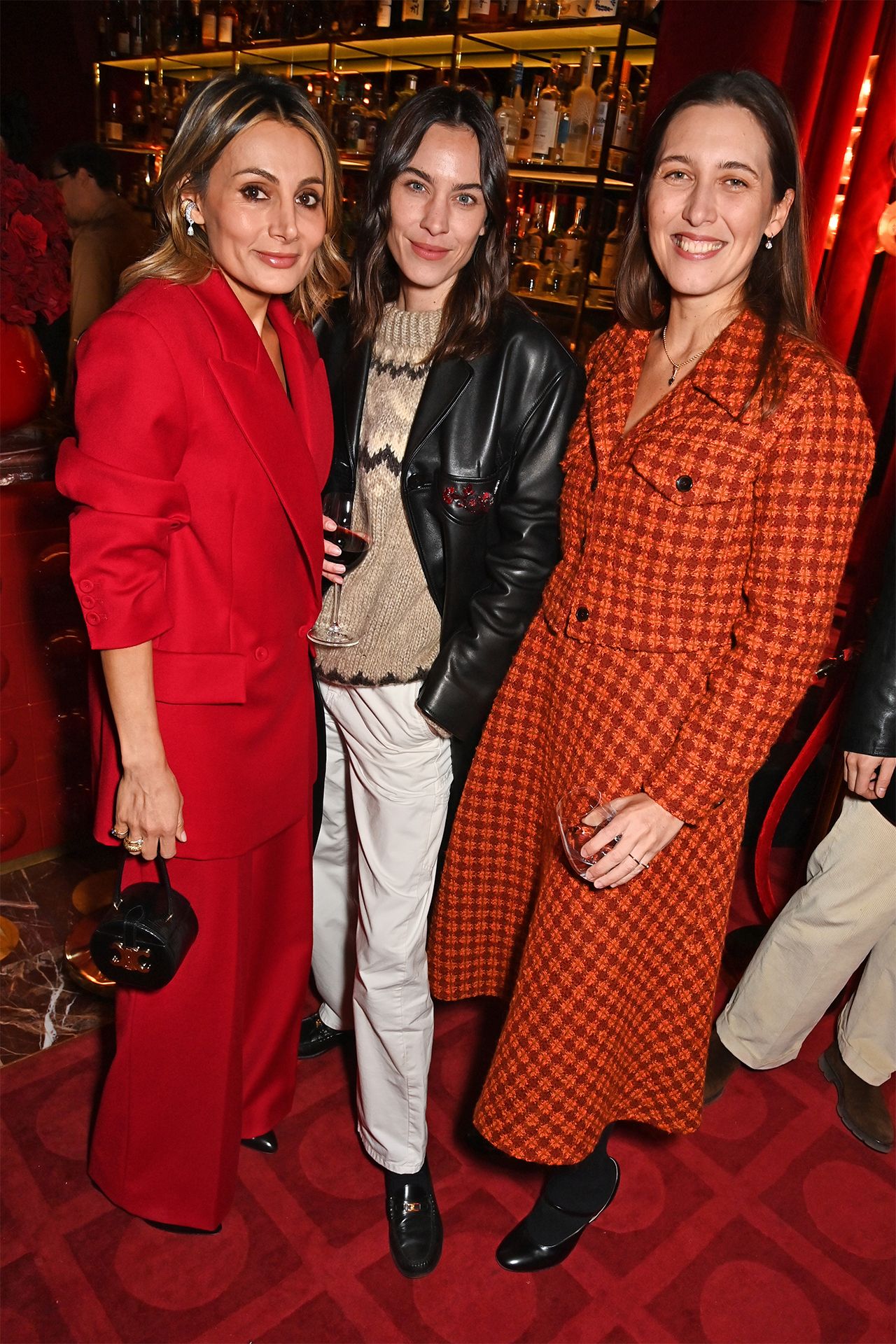 Image may contain Alexa Chung Fashion Clothing Coat Footwear Shoe Adult Person Cup Accessories and Jewelry