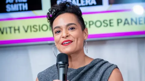 newNsight Photography Jasmine Escalera talking into a microphone