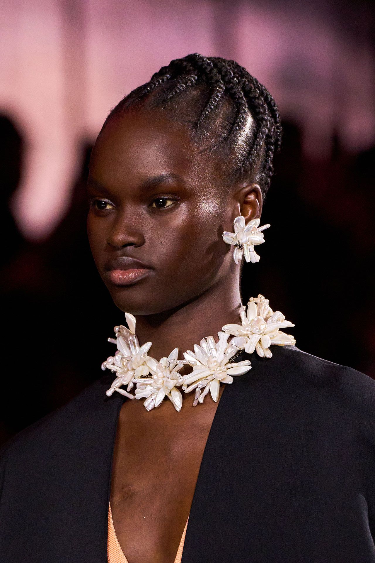 Image may contain Damaris Lewis Body Part Face Head Neck Person Hair Accessories Jewelry and Necklace