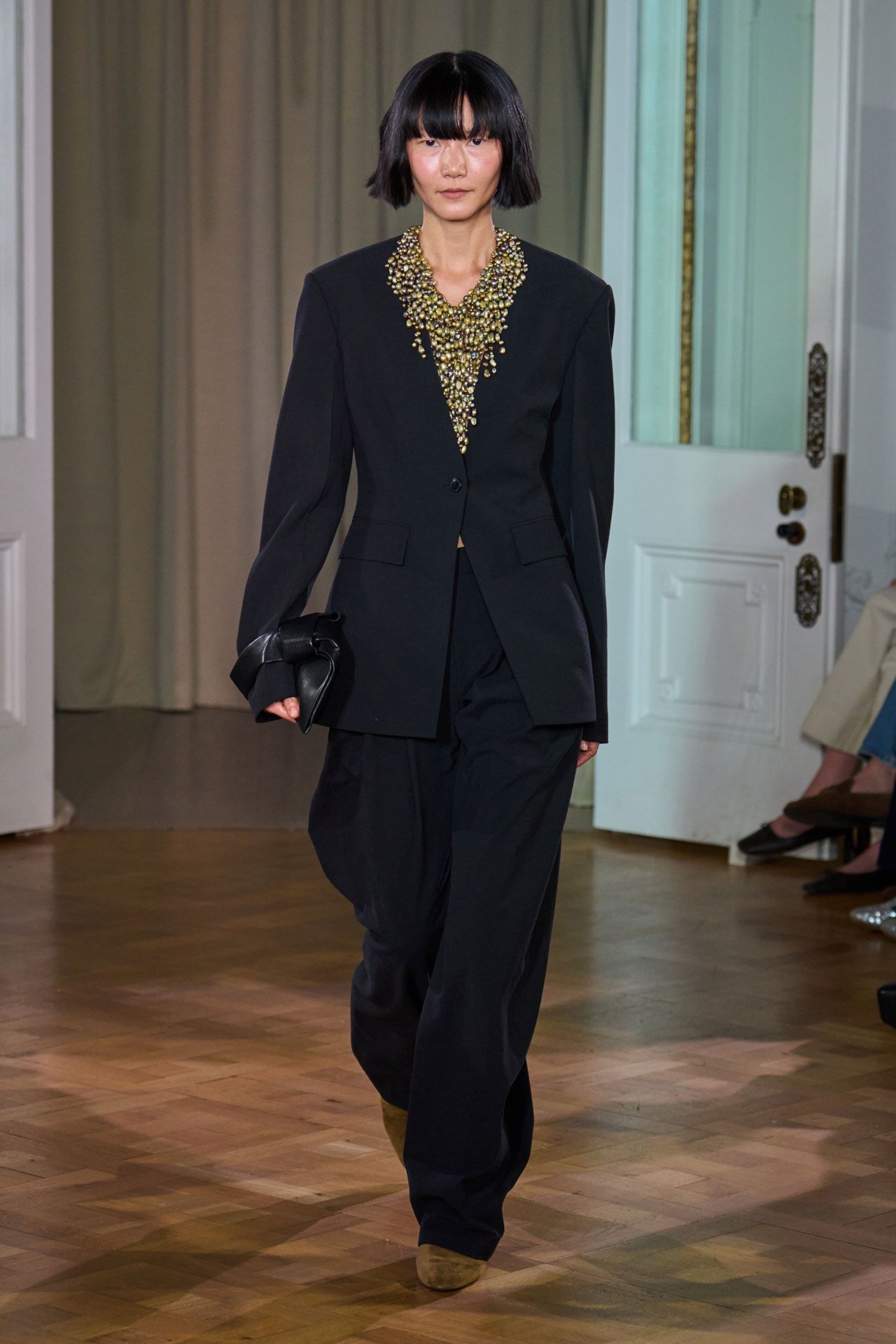 Image may contain Bae Doona Clothing Formal Wear Suit Blazer Coat Jacket Black Hair Hair Person and Adult