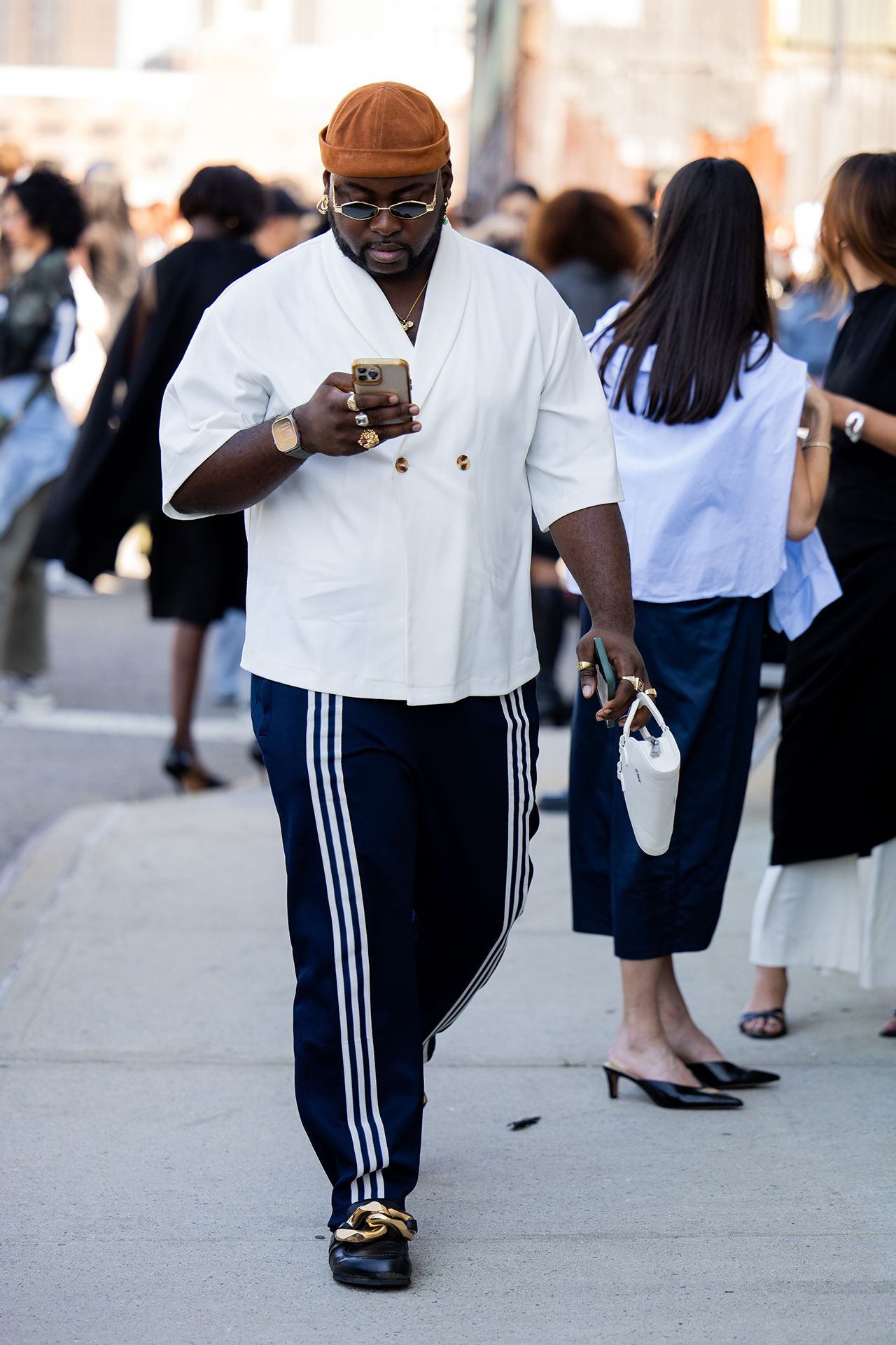 Image may contain Pedestrian Person Adult Accessories Bag Handbag Clothing Footwear High Heel Shoe and Shorts