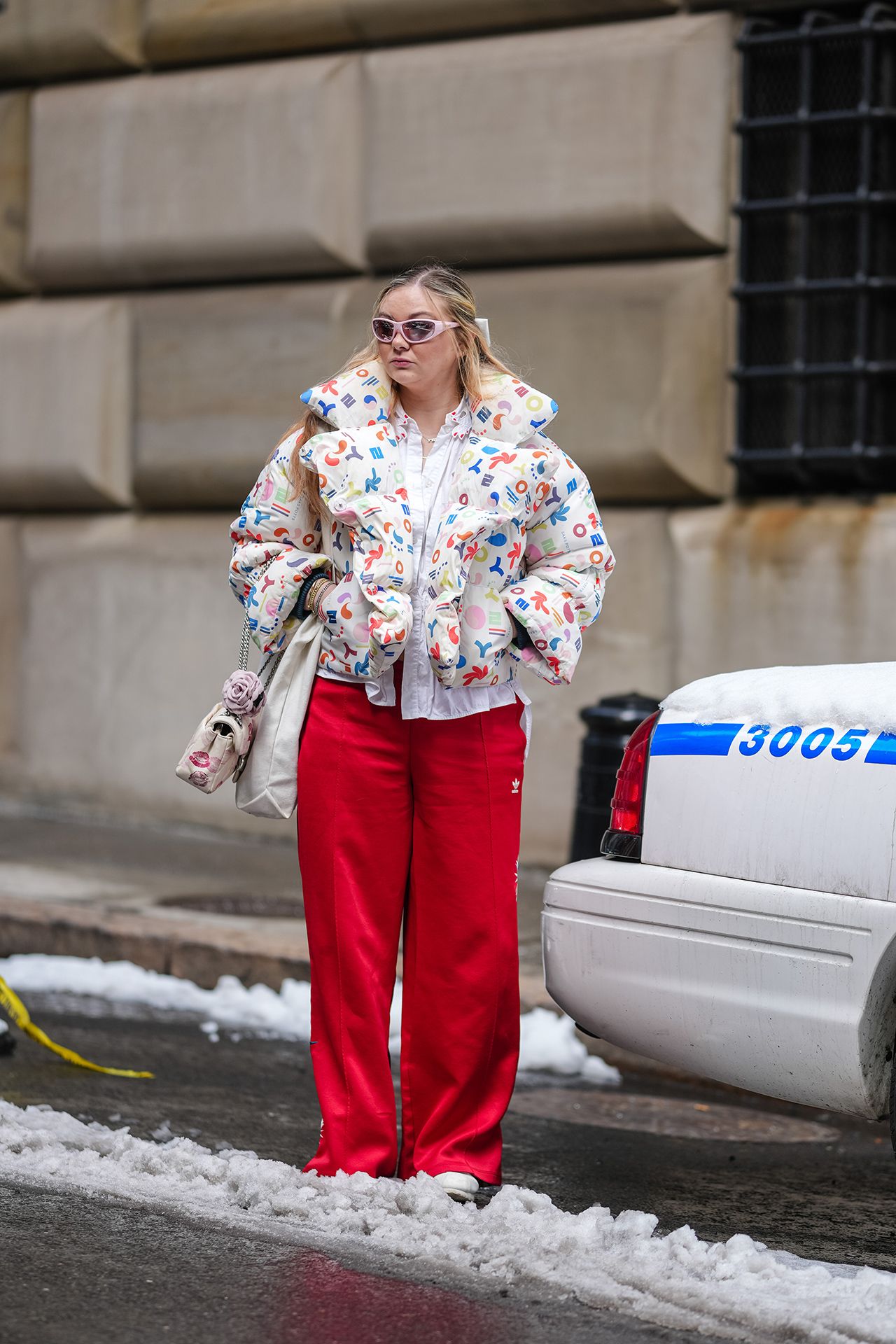 Image may contain Clothing Pants Coat Adult Person Jacket and Standing