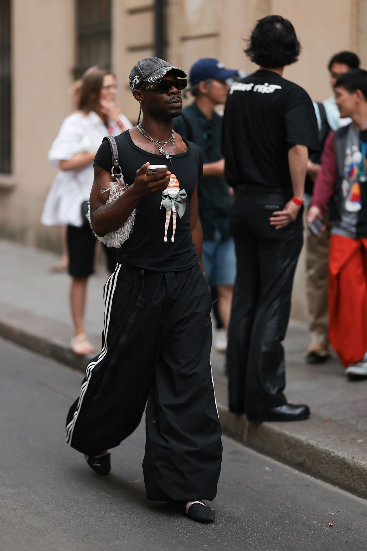 Image may contain Skibadee Pedestrian Person Adult Clothing Hat Footwear Shoe Accessories Glasses and Jewelry