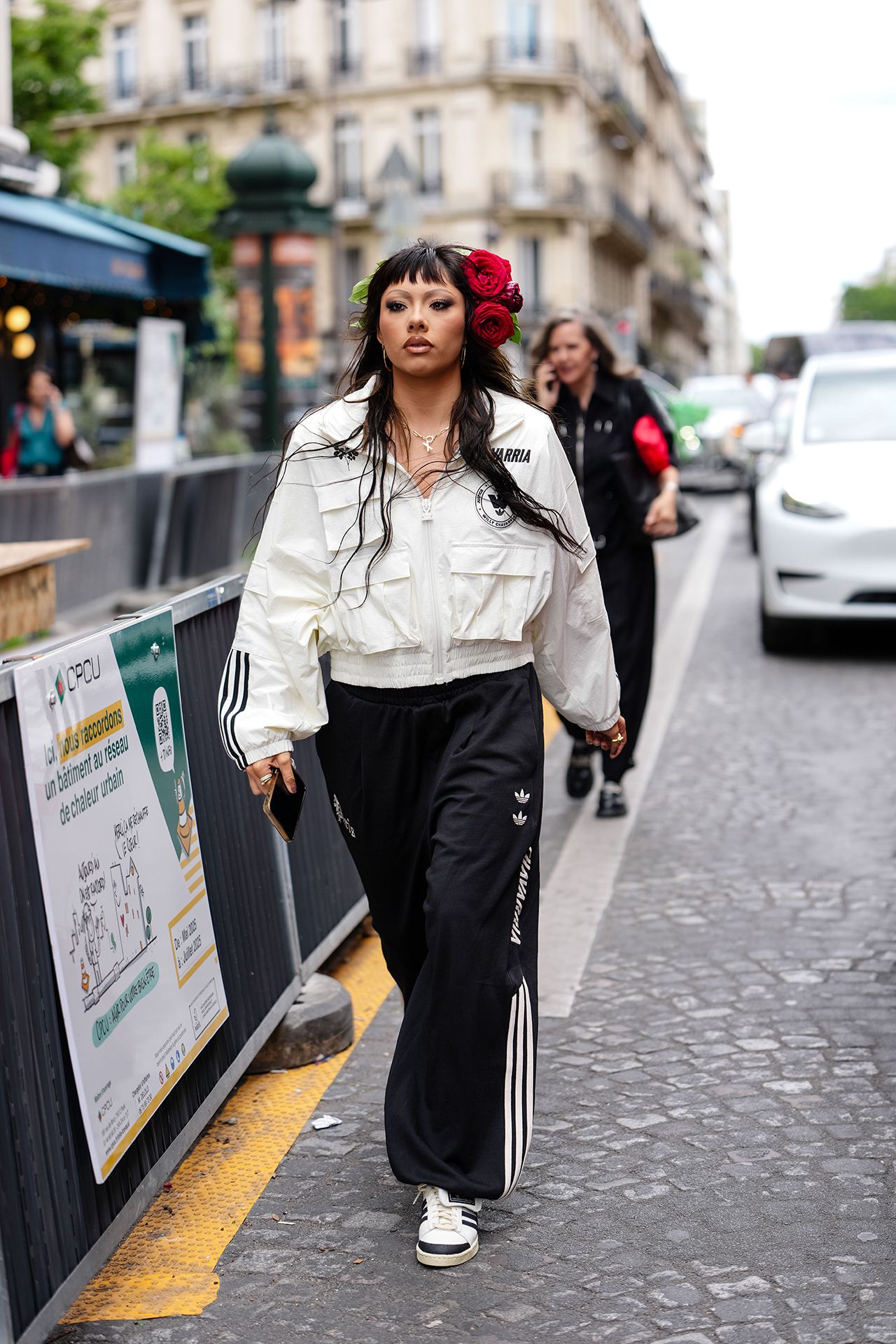 Image may contain Pedestrian Person Clothing Sleeve Pants Adult Car Transportation Vehicle Coat and Black Hair