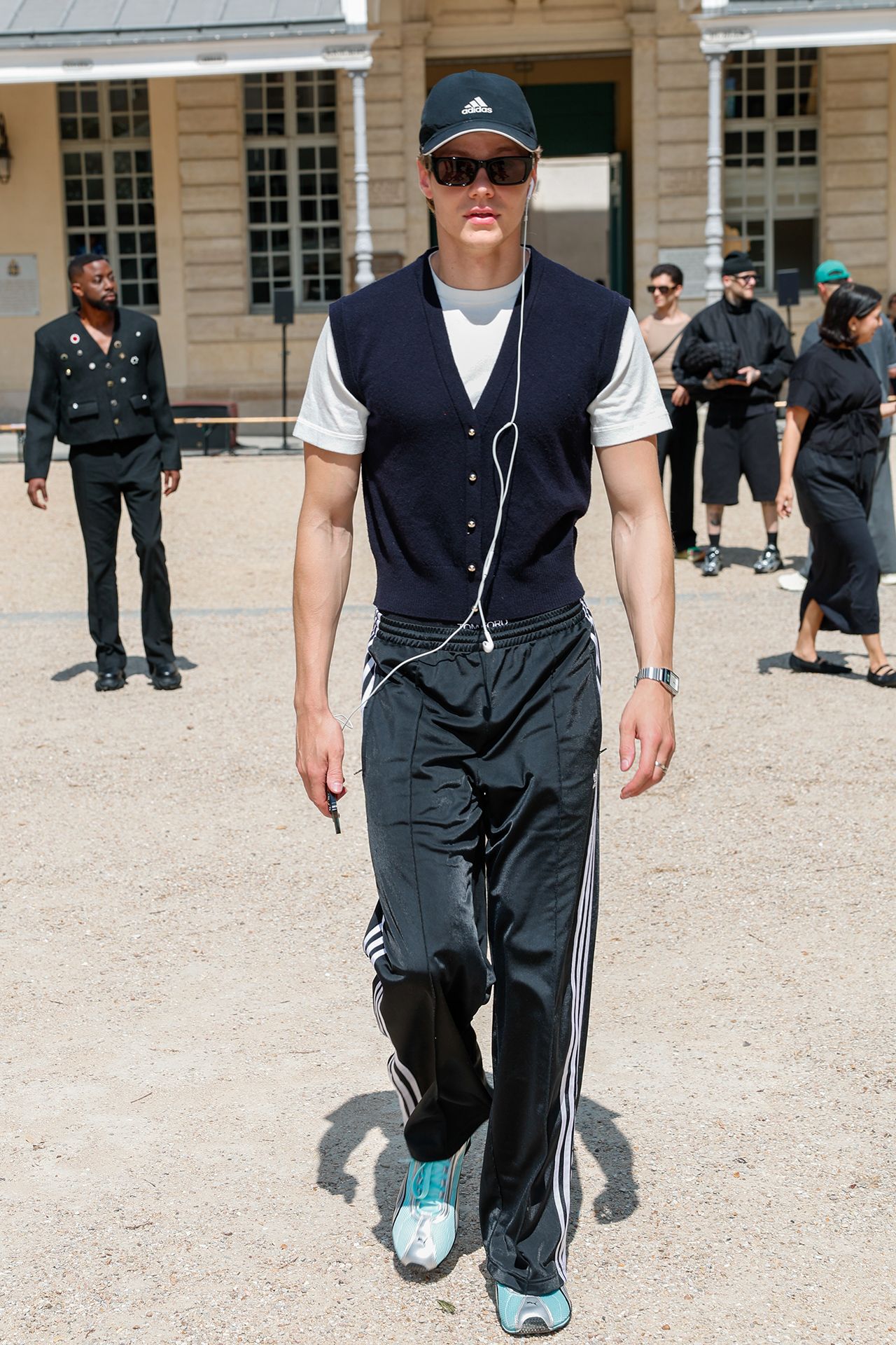 Image may contain Leo the Lion John Sullivan Clothing Sleeve Pants Adult Person Coat Wristwatch Footwear and Shoe