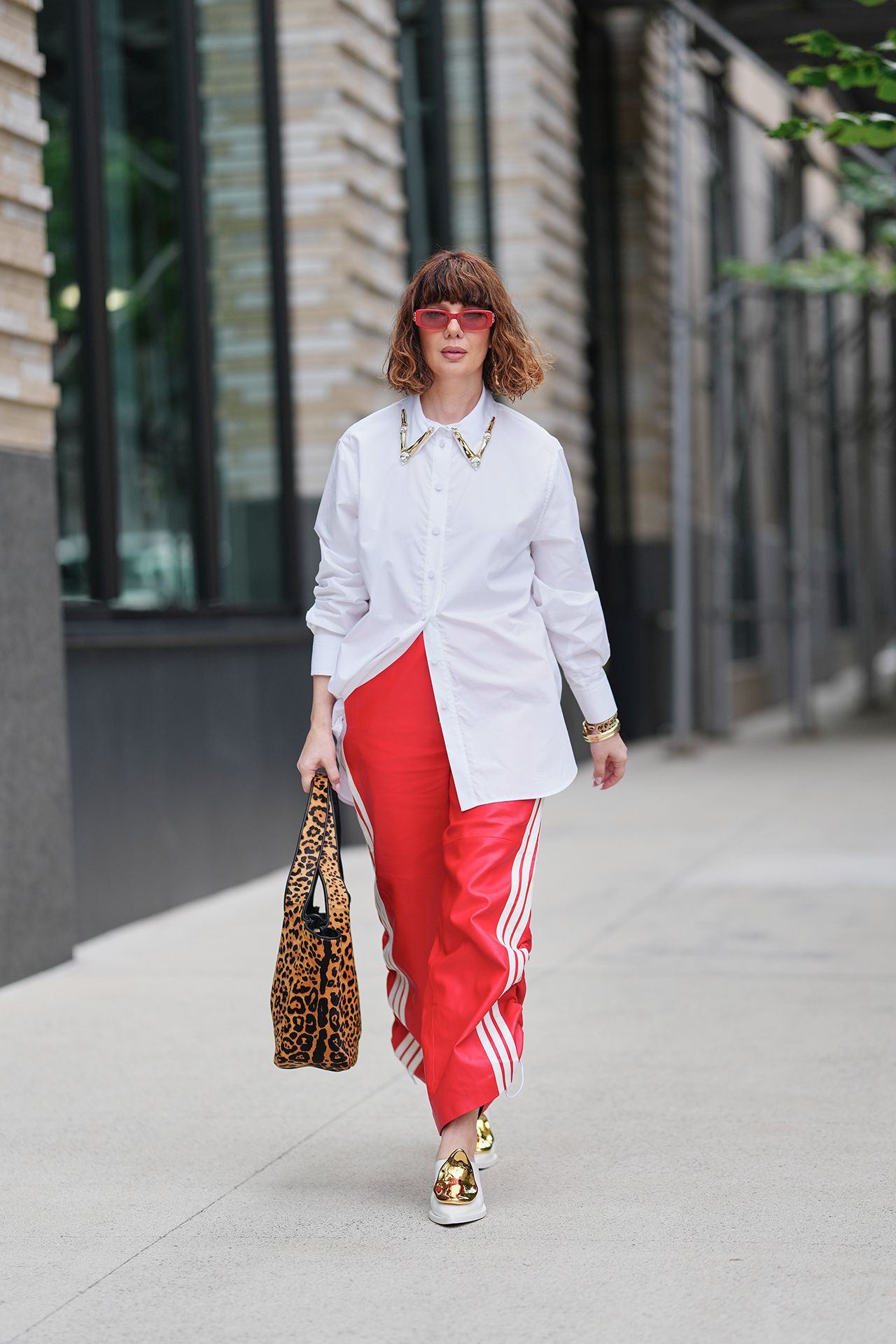 Image may contain Clothing Pants Adult Person Pedestrian and Coat