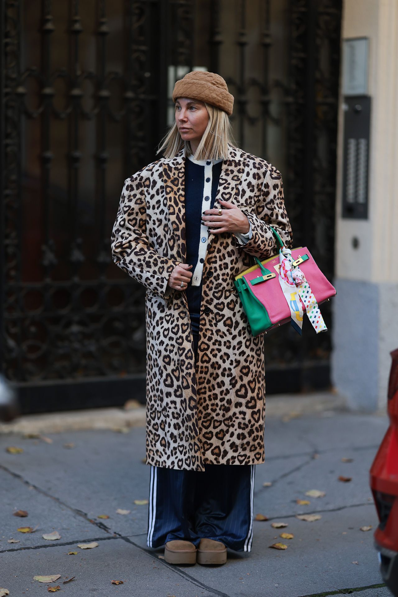 Image may contain Clothing Coat Person Adult Accessories Bag and Handbag