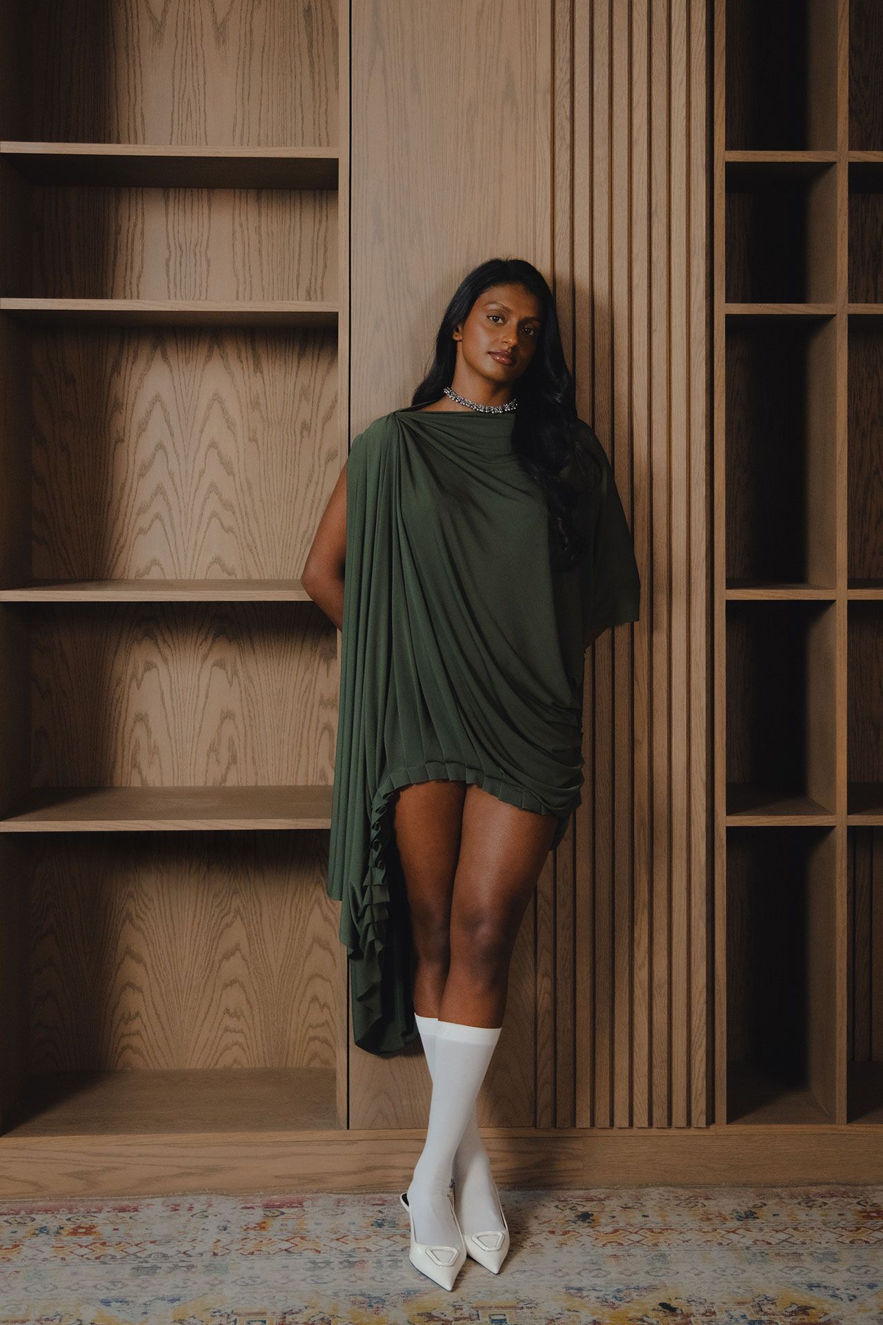 Image may contain Adult Person Face Happy Head Smile Indoors Interior Design Closet Cupboard and Furniture