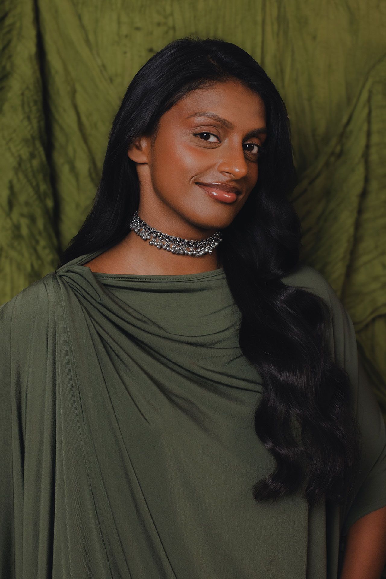 Image may contain Black Hair Hair Person Face Head Adult Happy Smile Body Part Neck Accessories and Jewelry