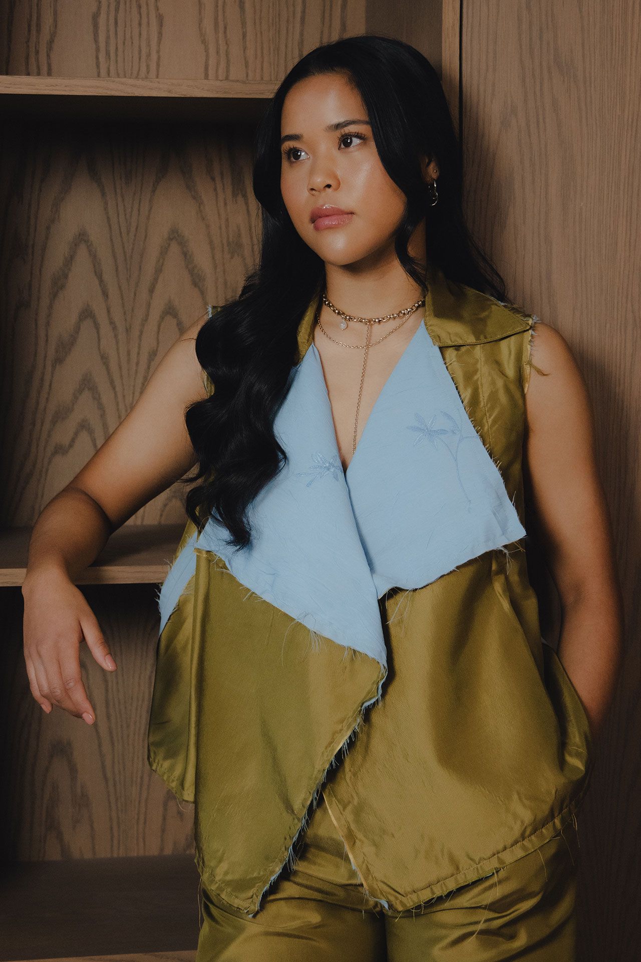 Image may contain Black Hair Hair Person Adult Blouse Clothing Sleeve Face and Head