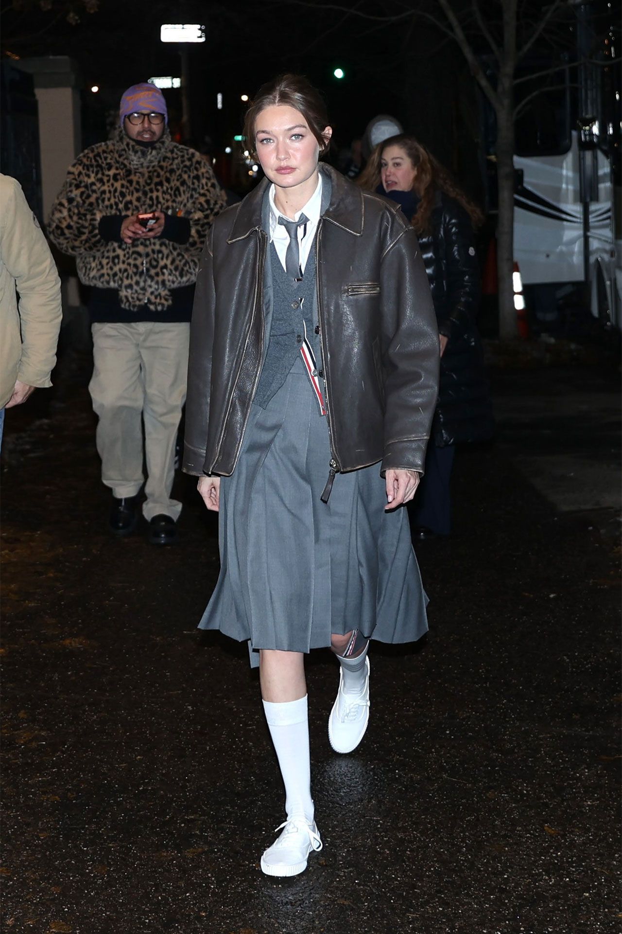 Image may contain Gigi Hadid Clothing Coat Jacket Person Teen Adult Accessories Formal Wear Tie Footwear and Shoe