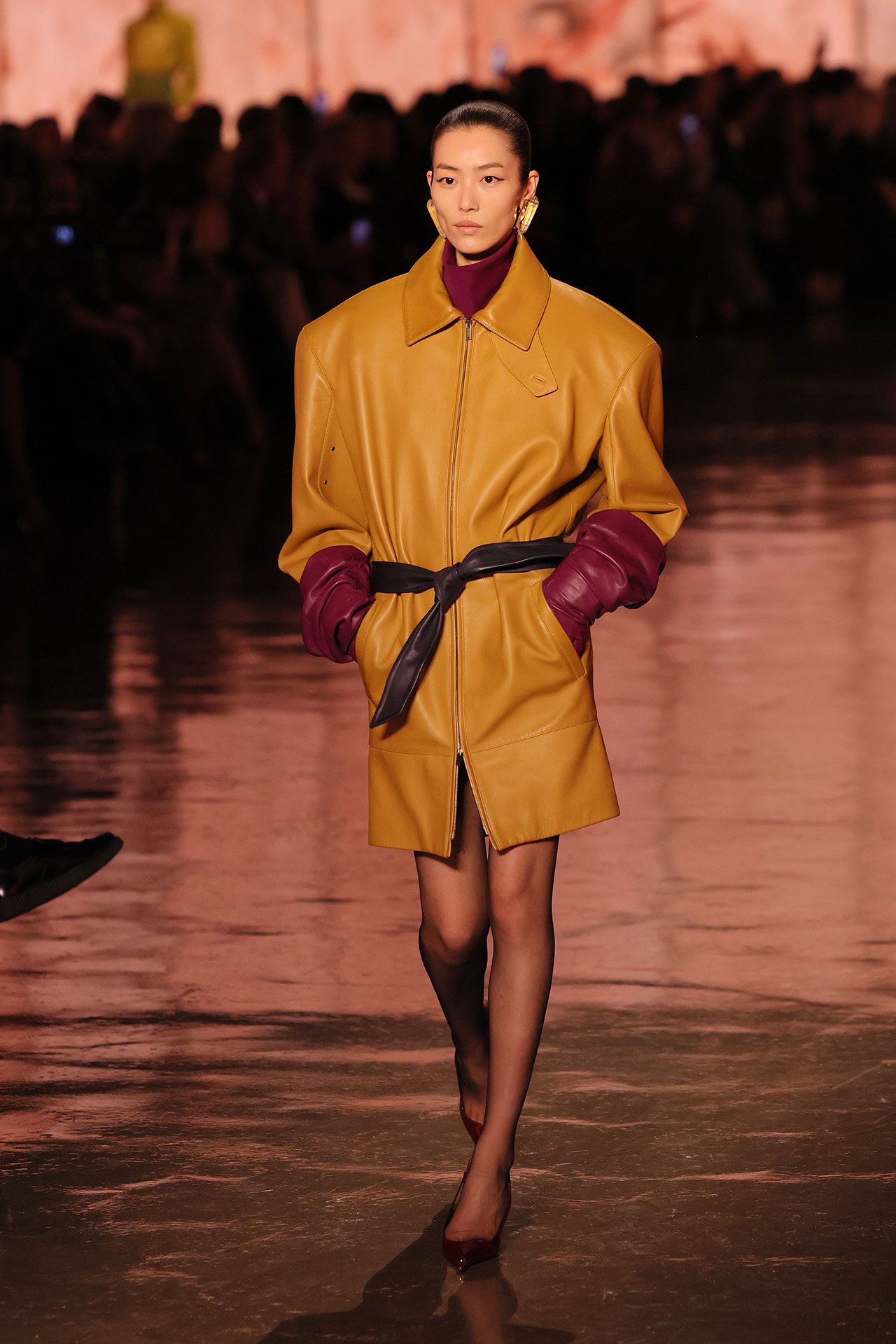 Image may contain Liu Wen Fashion Clothing Coat Performer Person Solo Performance Adult and Glove