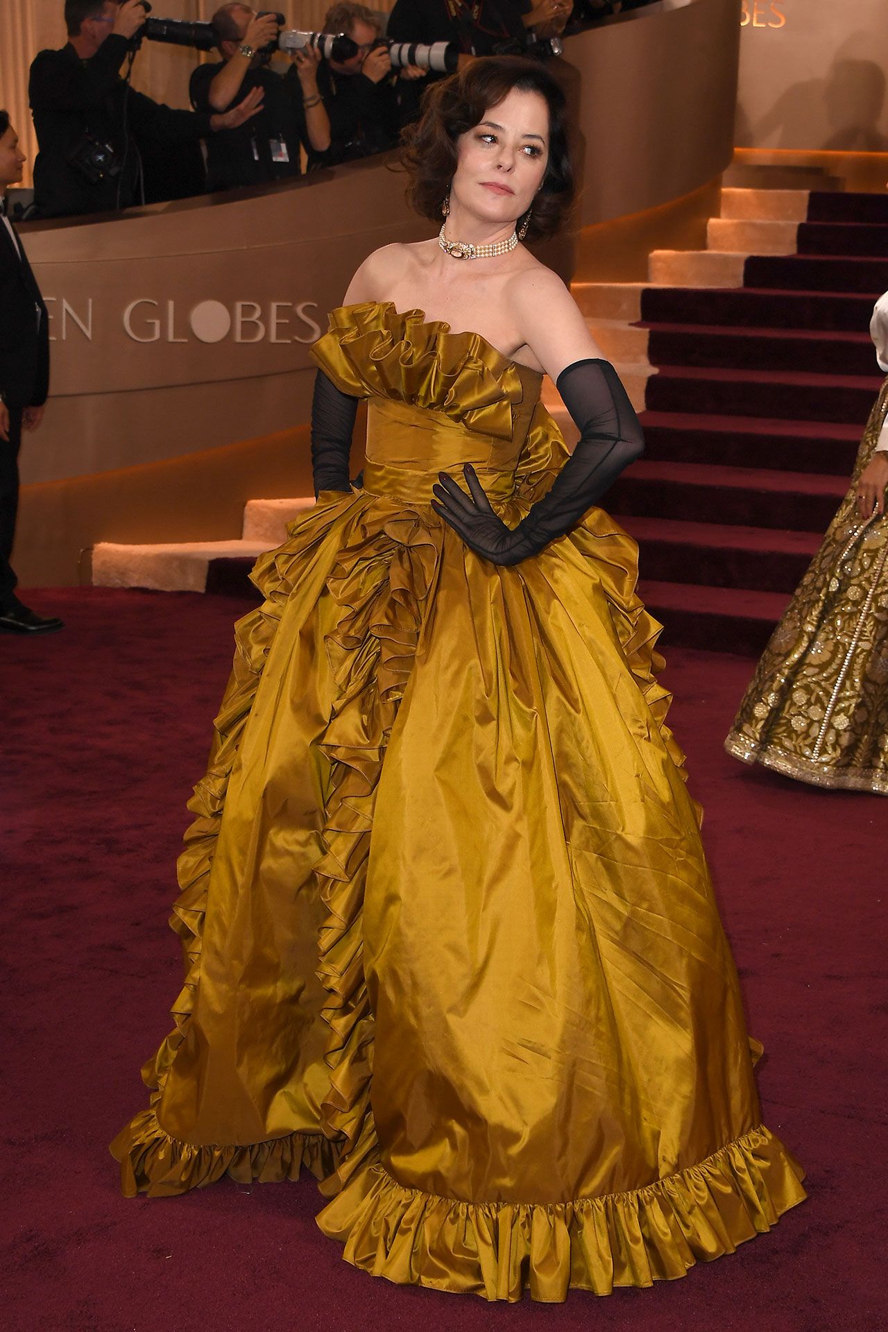 Image may contain Parker Posey Yumnam Kamala Devi Clothing Dress Person Fashion Formal Wear Gown Adult and Wedding