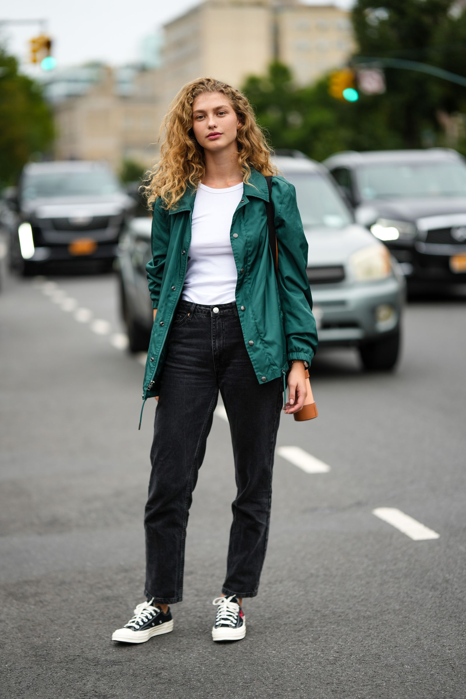 Image may contain Clothing Pants Coat Blazer Jacket Person Teen and Jeans