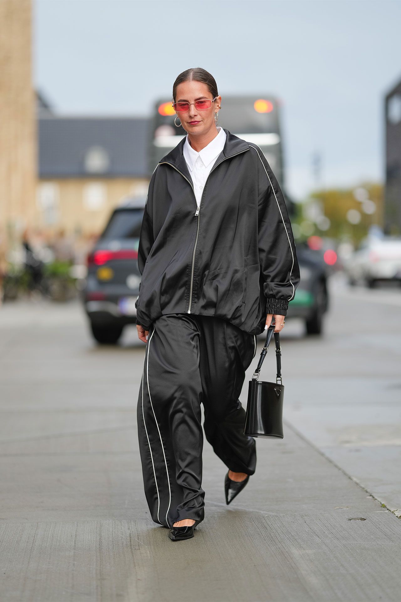 Image may contain Clothing Coat Person Walking Adult Pedestrian and Jacket