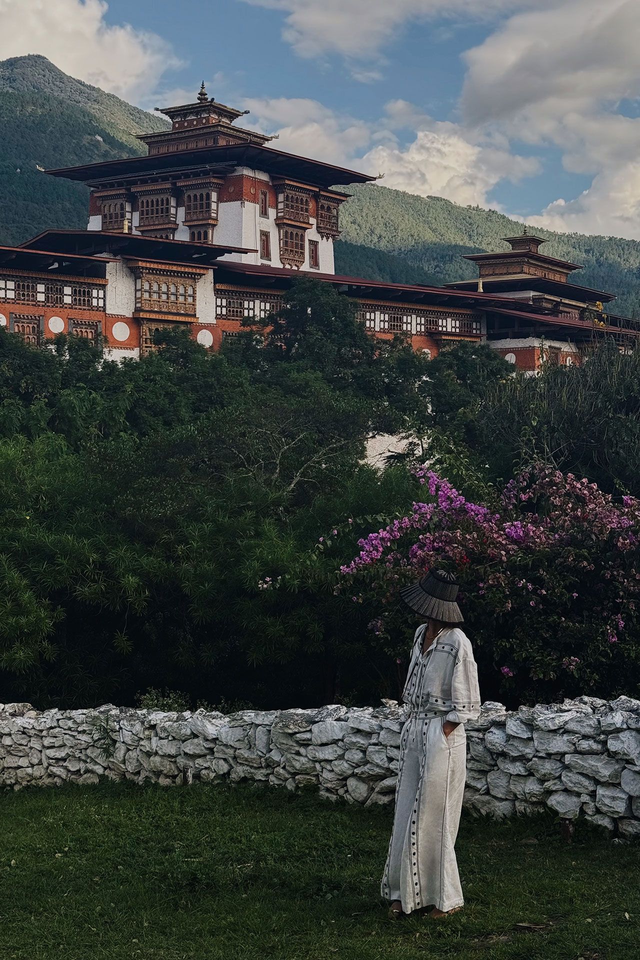 Image may contain Architecture Building Housing House Adult Person Landmark Mansion Palace Clothing and Hat