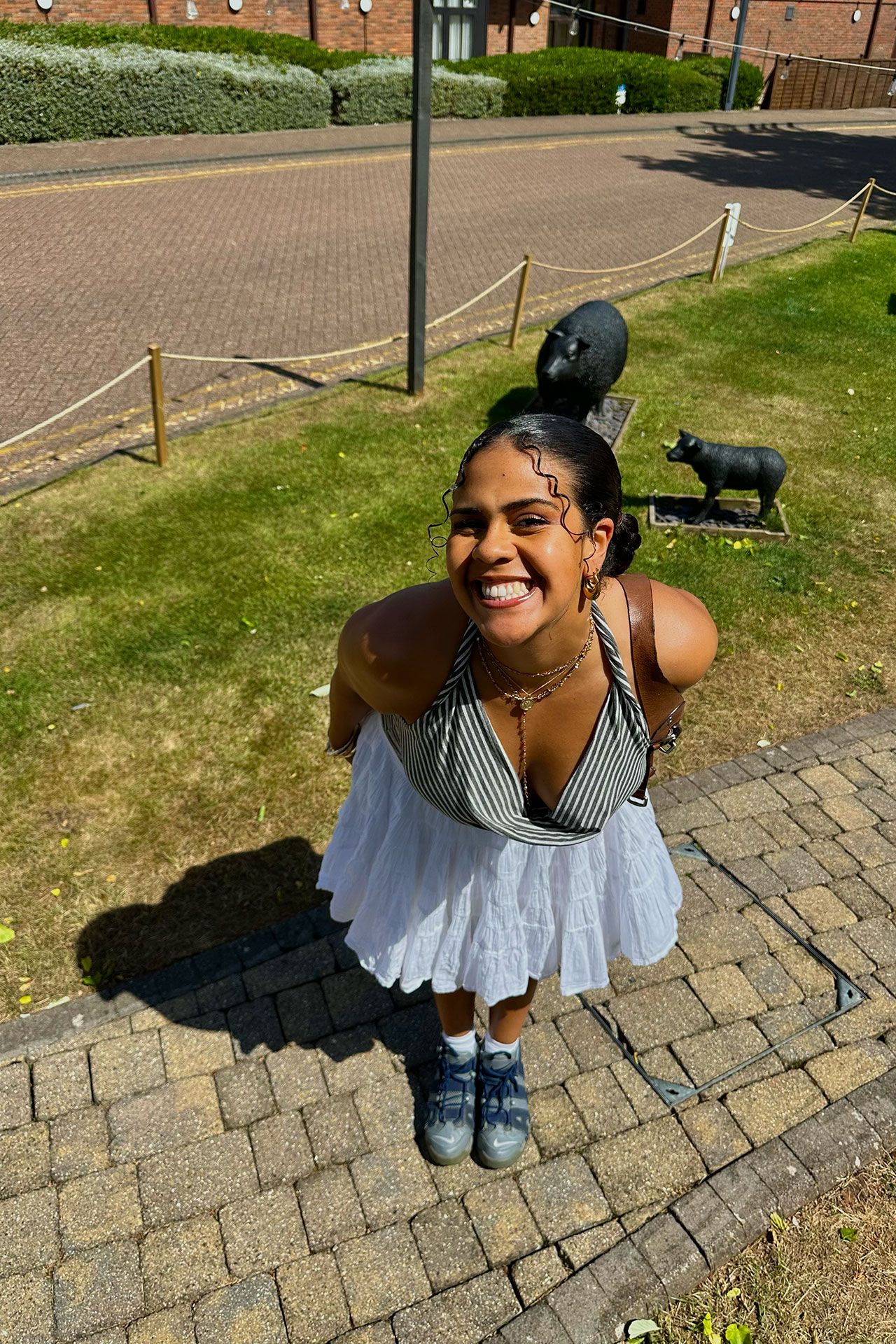 Image may contain Person Sitting Child Photobombing Face Head Photography Portrait Animal Mammal and Pig