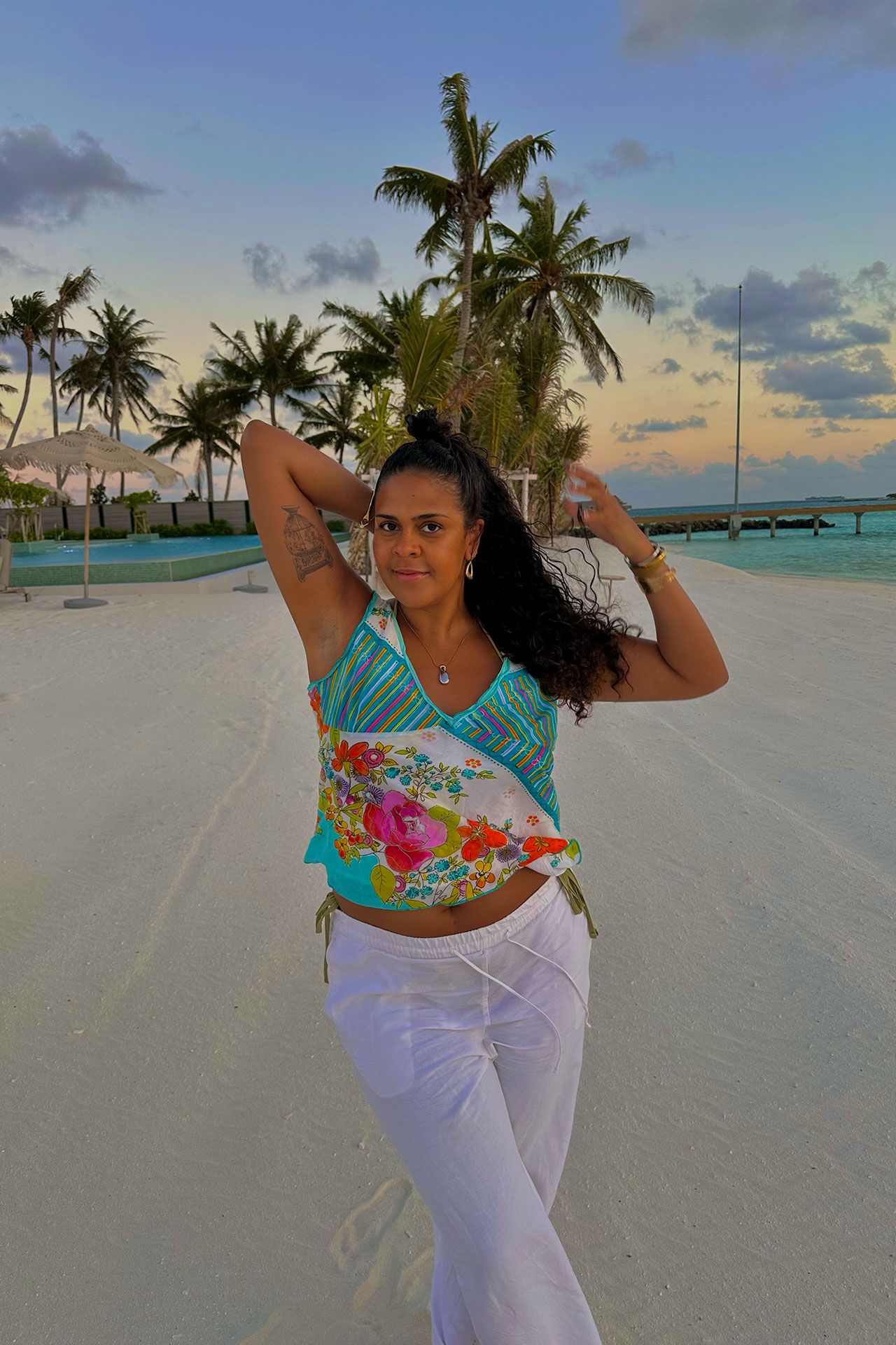 Image may contain Beachwear Clothing Adult Person and Sleeve