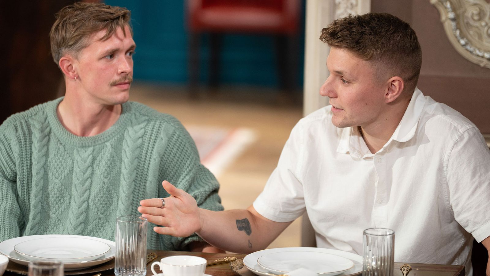 Image may contain Person Arm Body Part Cup Skin and Tattoo