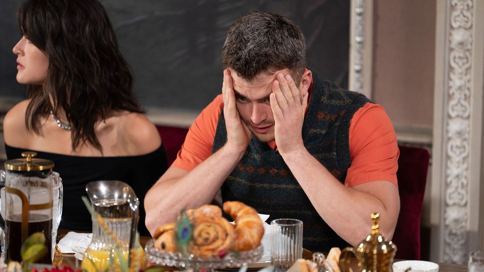 Image may contain Head Person Face Adult Sad Cup Bread and Food