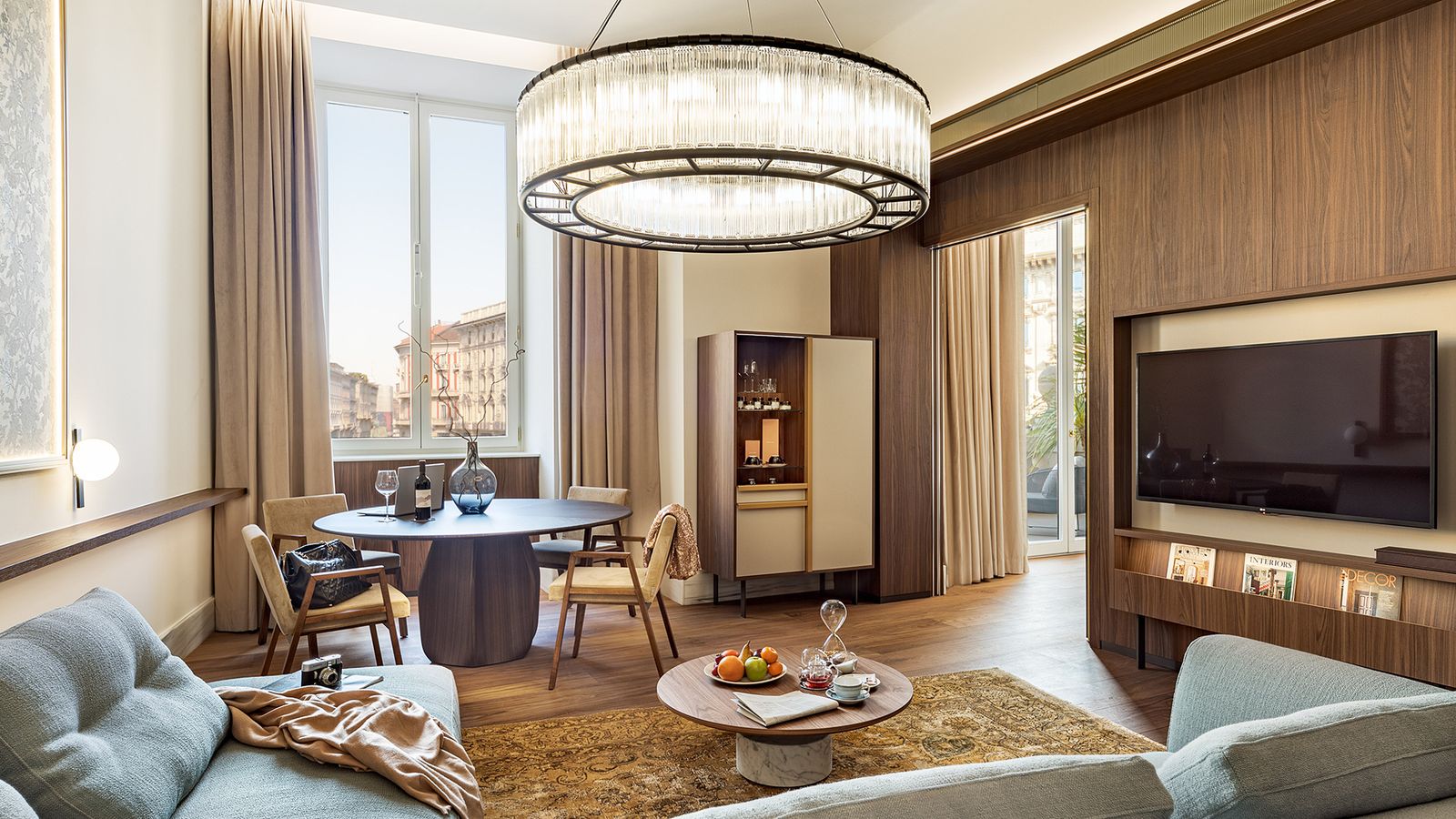 Image may contain Indoors Interior Design Chandelier Lamp Architecture Building Dining Room and Dining Table