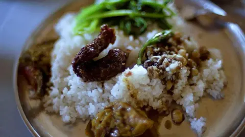 Getty Images A lunch of traditional smoked pork and Naga chili chutney at a roadside restaurant in Nagaland. 