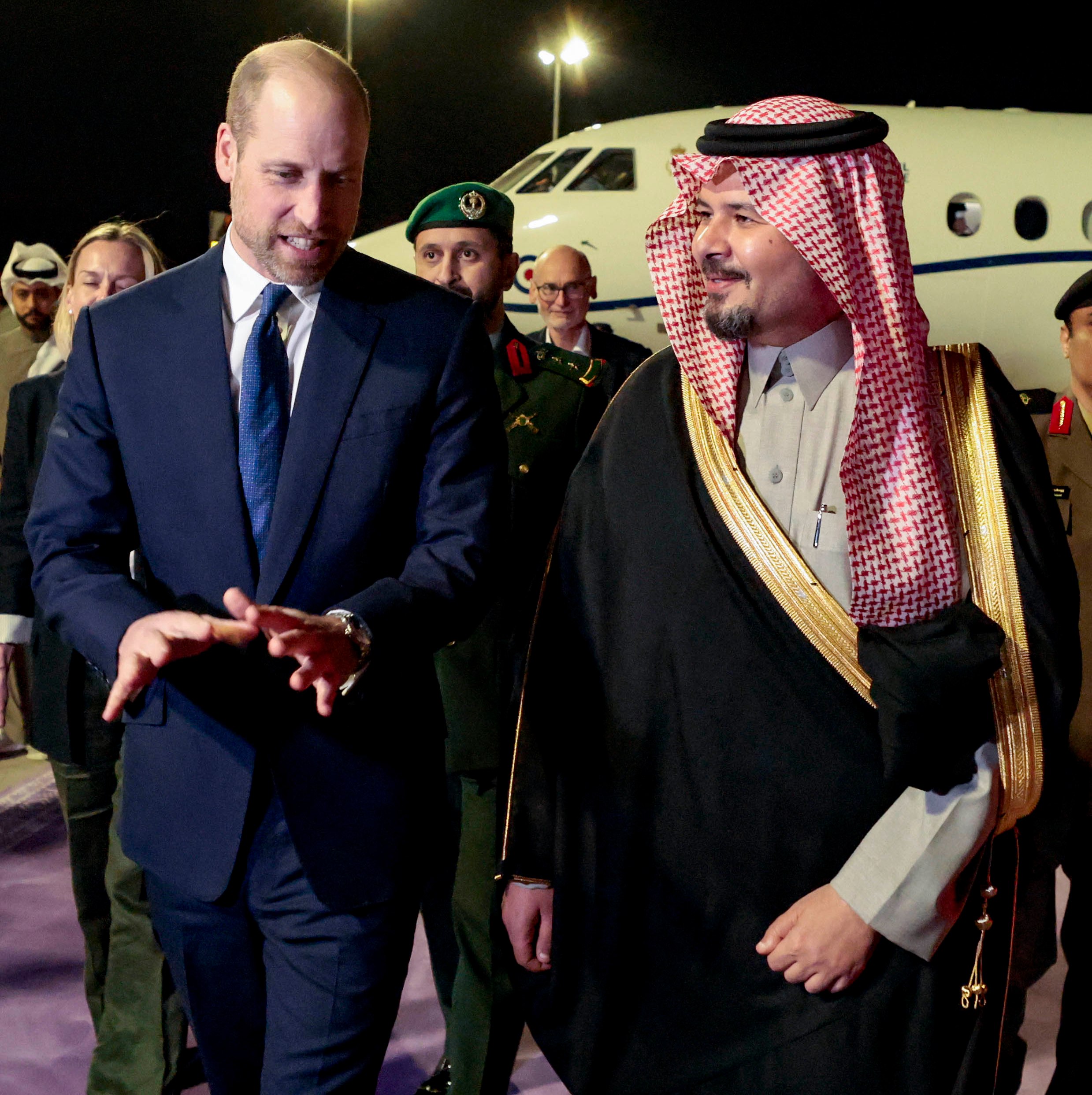 Prince William and Prince Salman bin Sultan bin Abdulaziz Al Saud walking together.