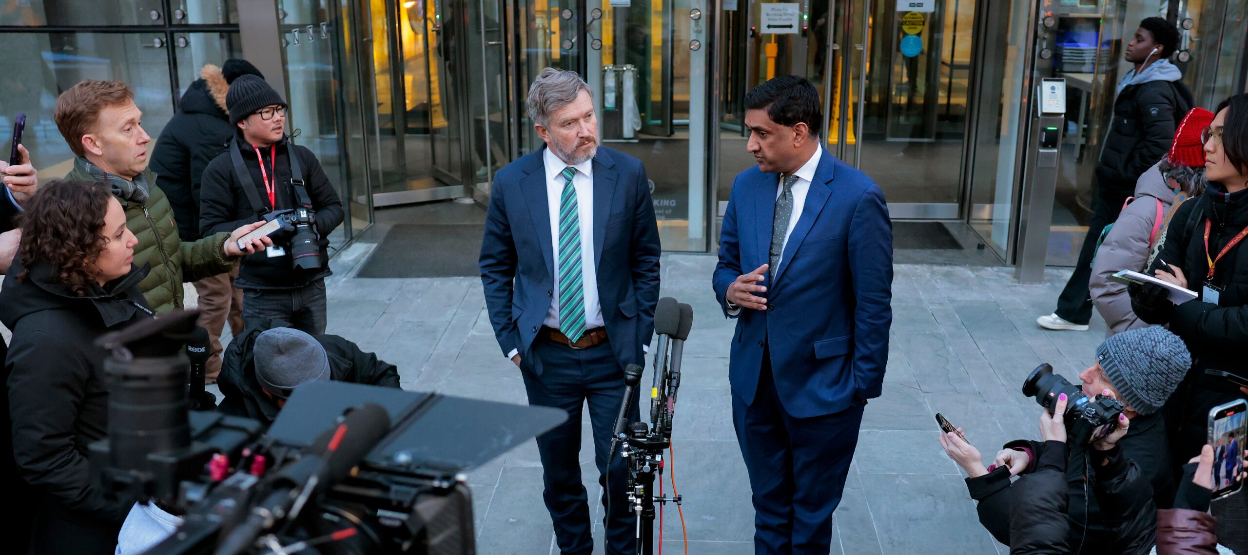 Reps. Massie and Khanna speaking to reporters about the Epstein files outside the Department of Justice.