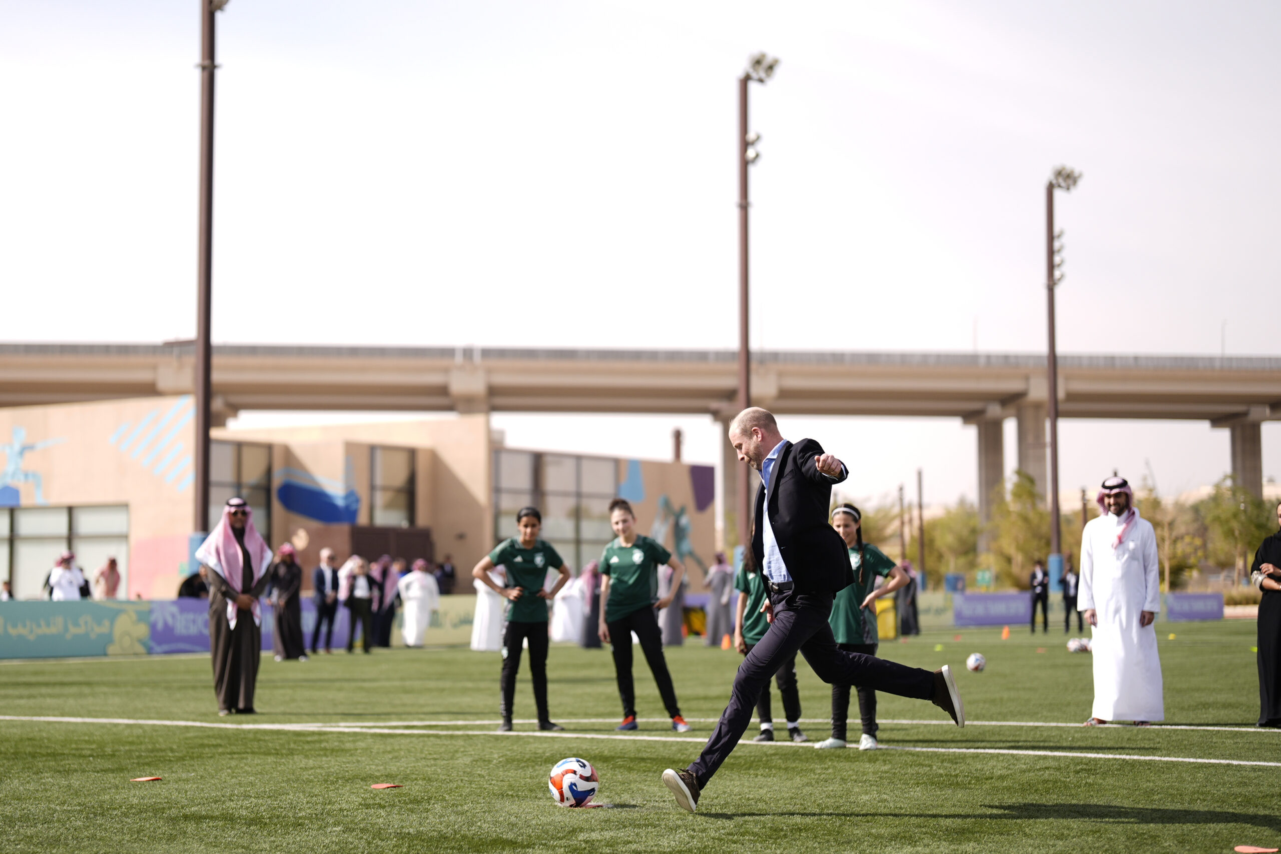 Prince William playing soccer with girls in Saudi Arabia